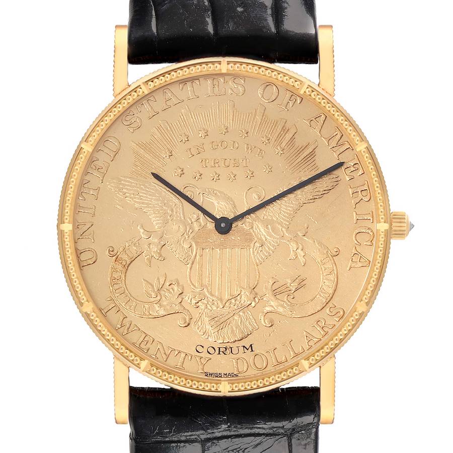 The Corum Coin Watch is shown from the front, highlighting its coin-designed dial, black strap, and gold case.