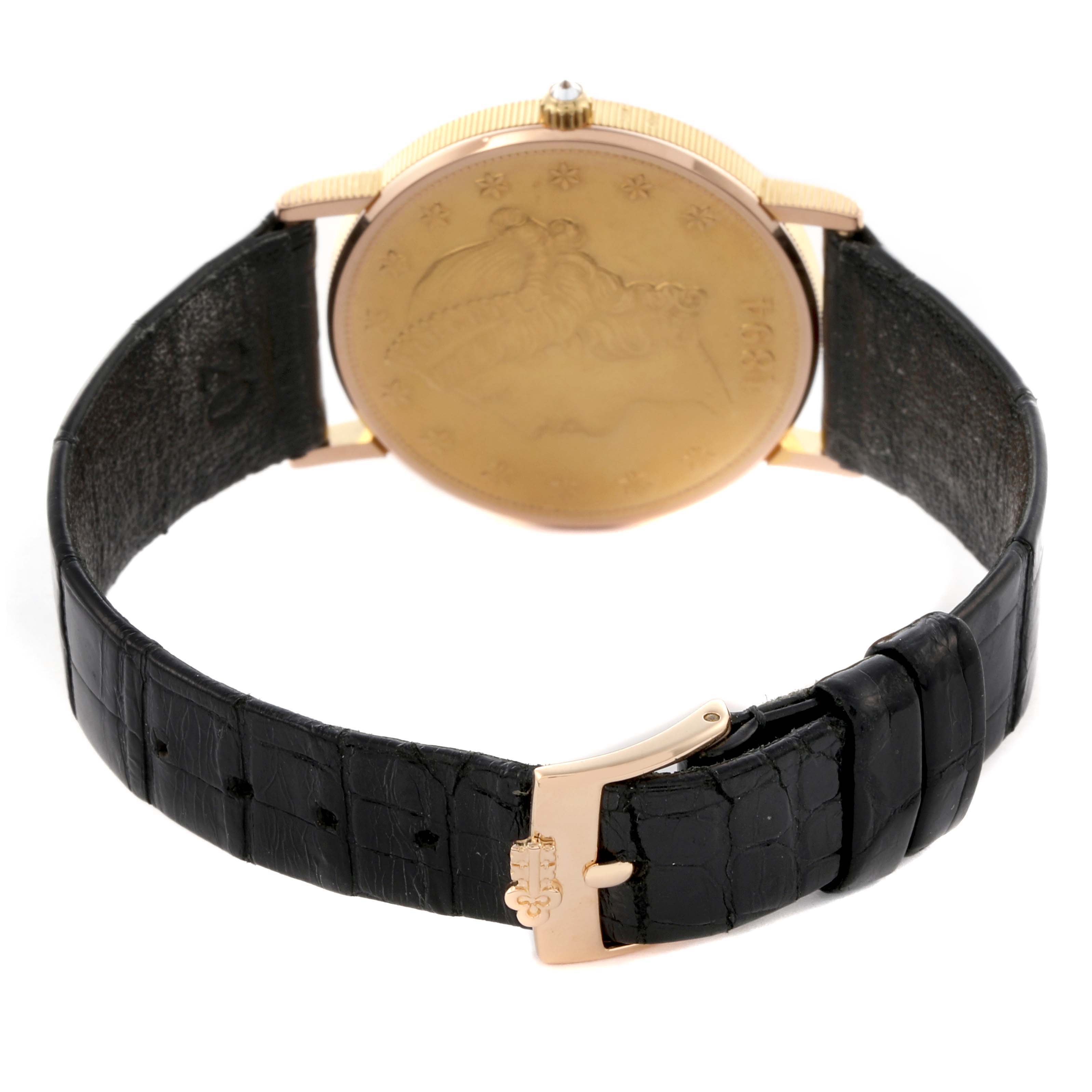 The Corum Coin Watch 1894 Men's Yellow Gold Champagne Dial 1894 Men's Yellow Gold Champagne Dial is shown from the back, displaying the case back, crown, and black leather strap with a buckle.