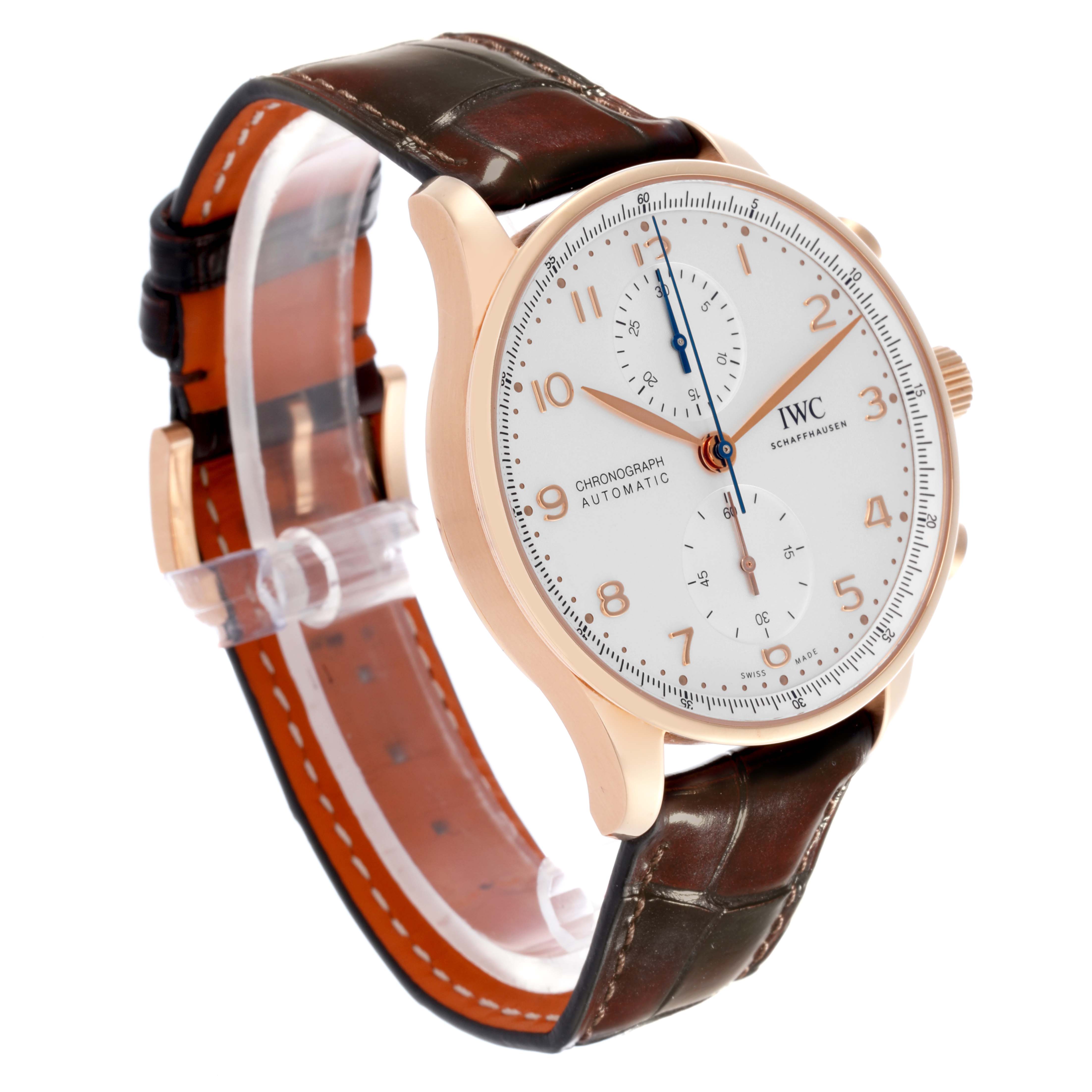 The IWC Portuguese IW371611 Men's Rose Gold Silver Dial IW371611 Men's Rose Gold Silver Dial watch is shown at a three-quarter angle, highlighting its face, side, and leather strap.