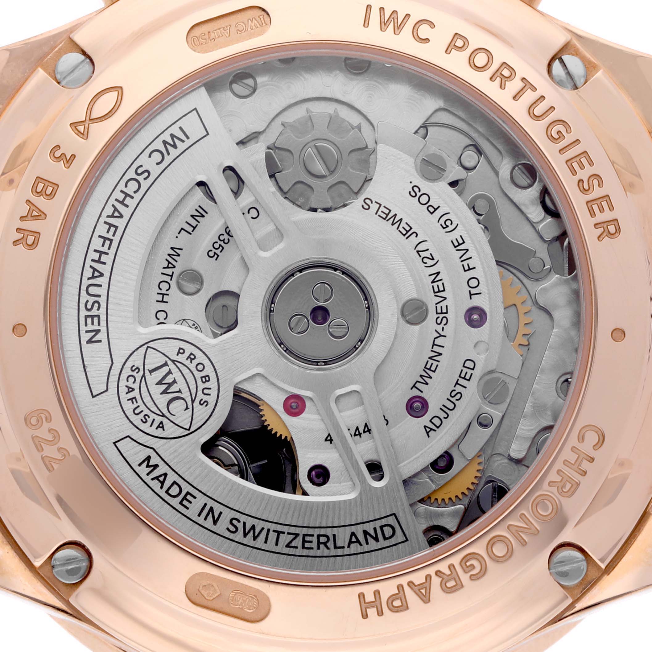 The image shows the back of an IWC Portuguese IW371611 Men's Rose Gold Silver Dial IW371611 Men's Rose Gold Silver Dial model watch, highlighting its intricate movement and components.