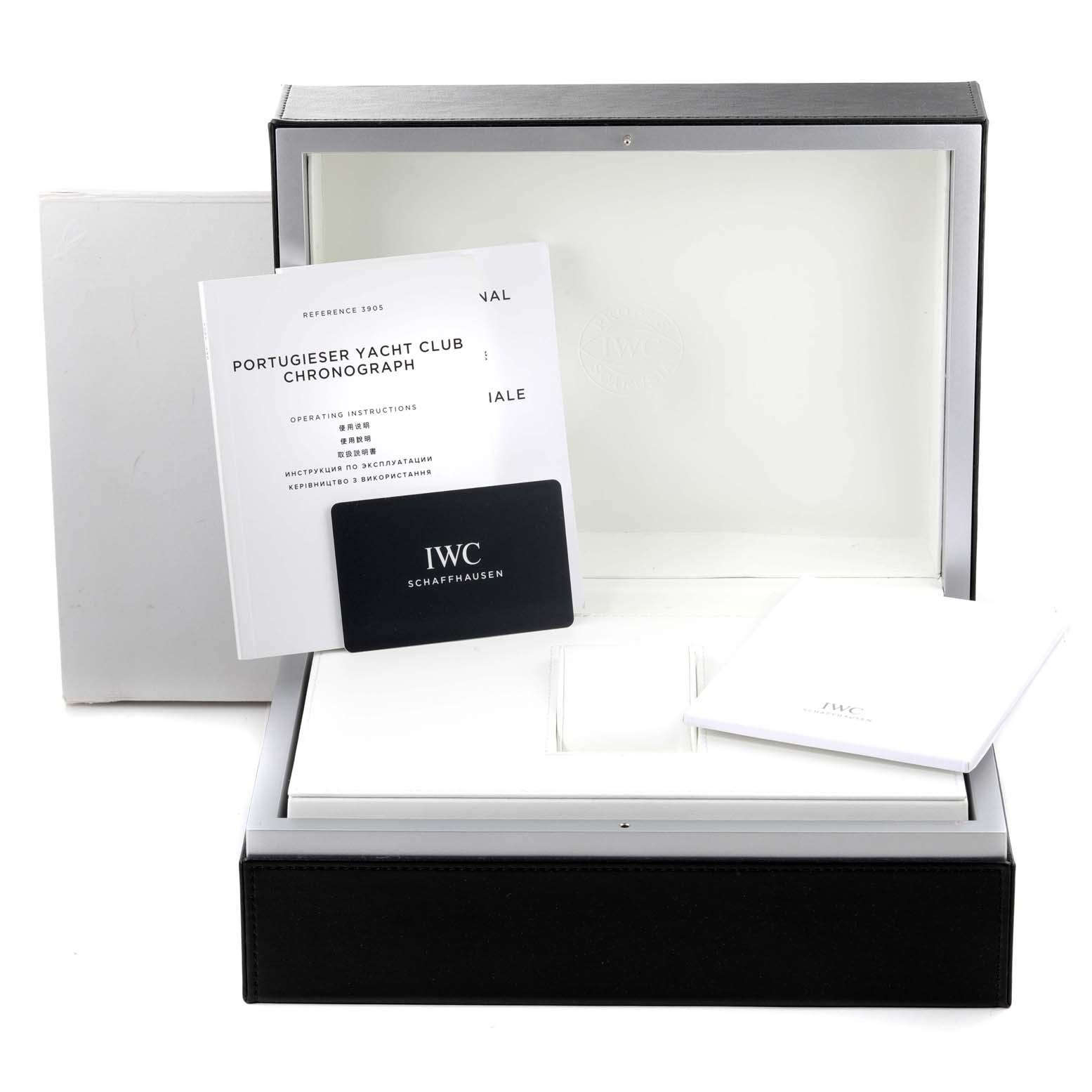 The image shows the box, instruction manual, and a card for the IWC Portuguese IW390507 Men's Stainless Steel Blue Dial IW390507 Men's Stainless Steel Blue Dial Yacht Club Chronograph watch.