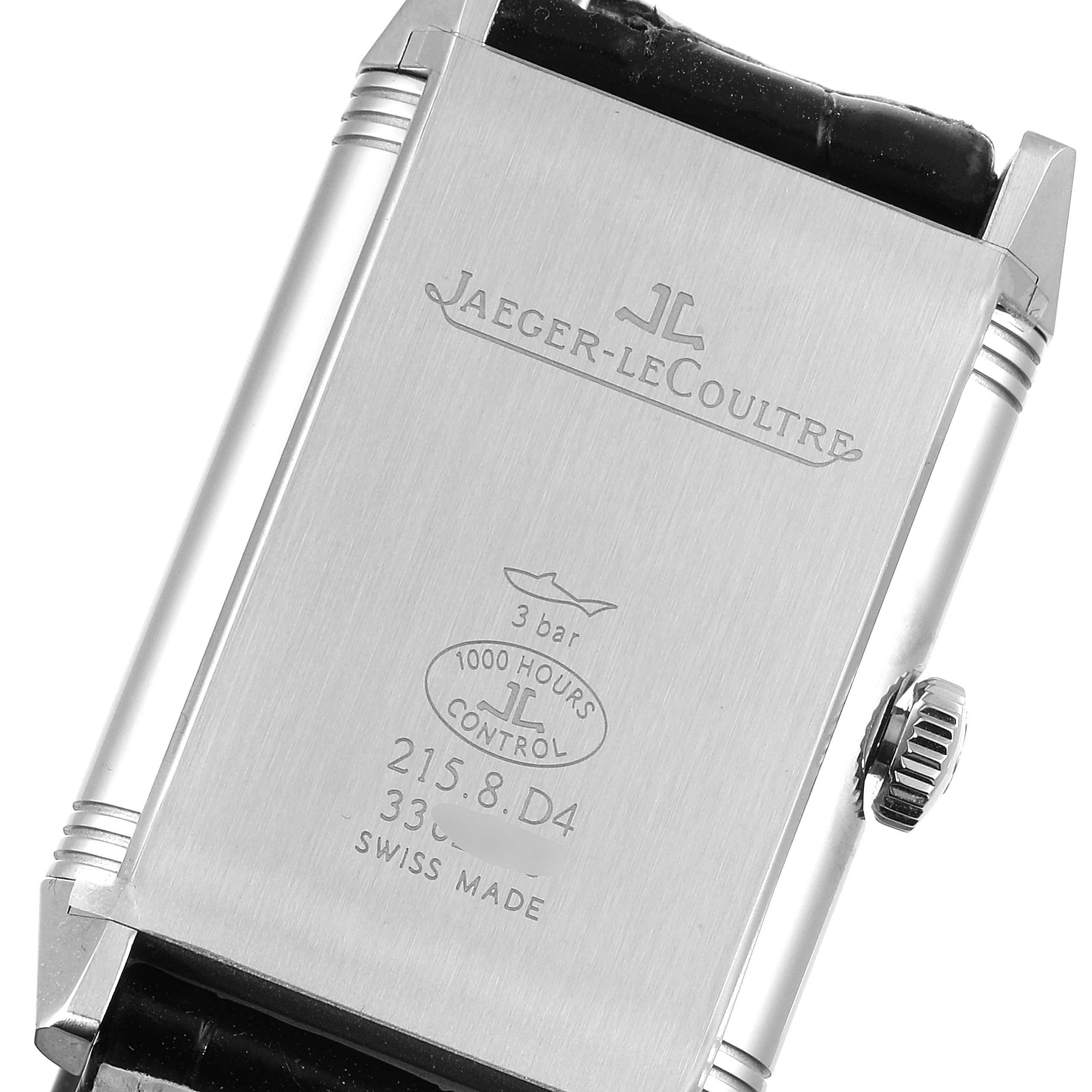 The image shows the back case of a Jaeger-LeCoultre Reverso watch, displaying the brand's name, model details, and water resistance.
