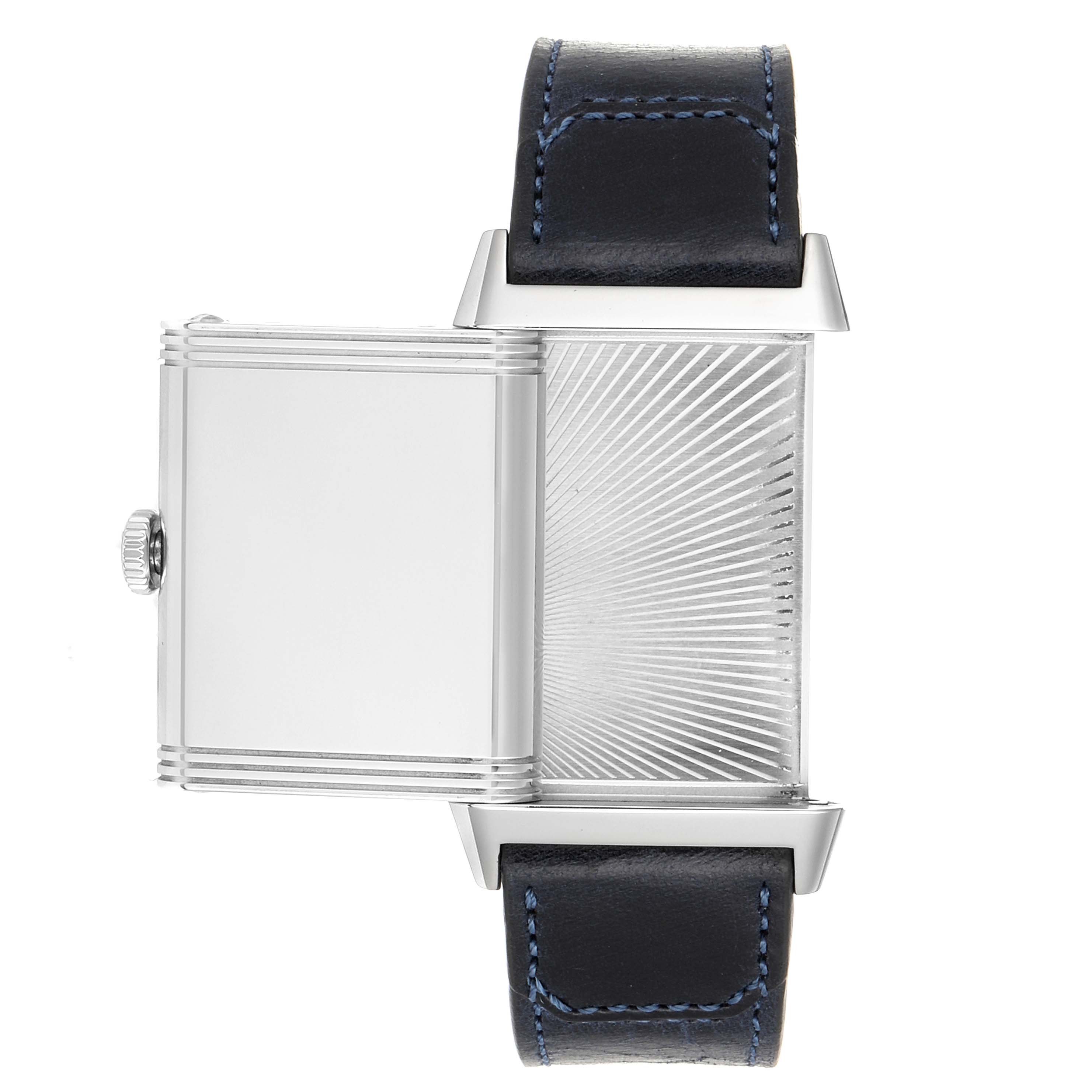 A Reverso model by Jaeger LeCoultre is shown from above with the reversible case flipped, displaying the back and a part of the strap.
