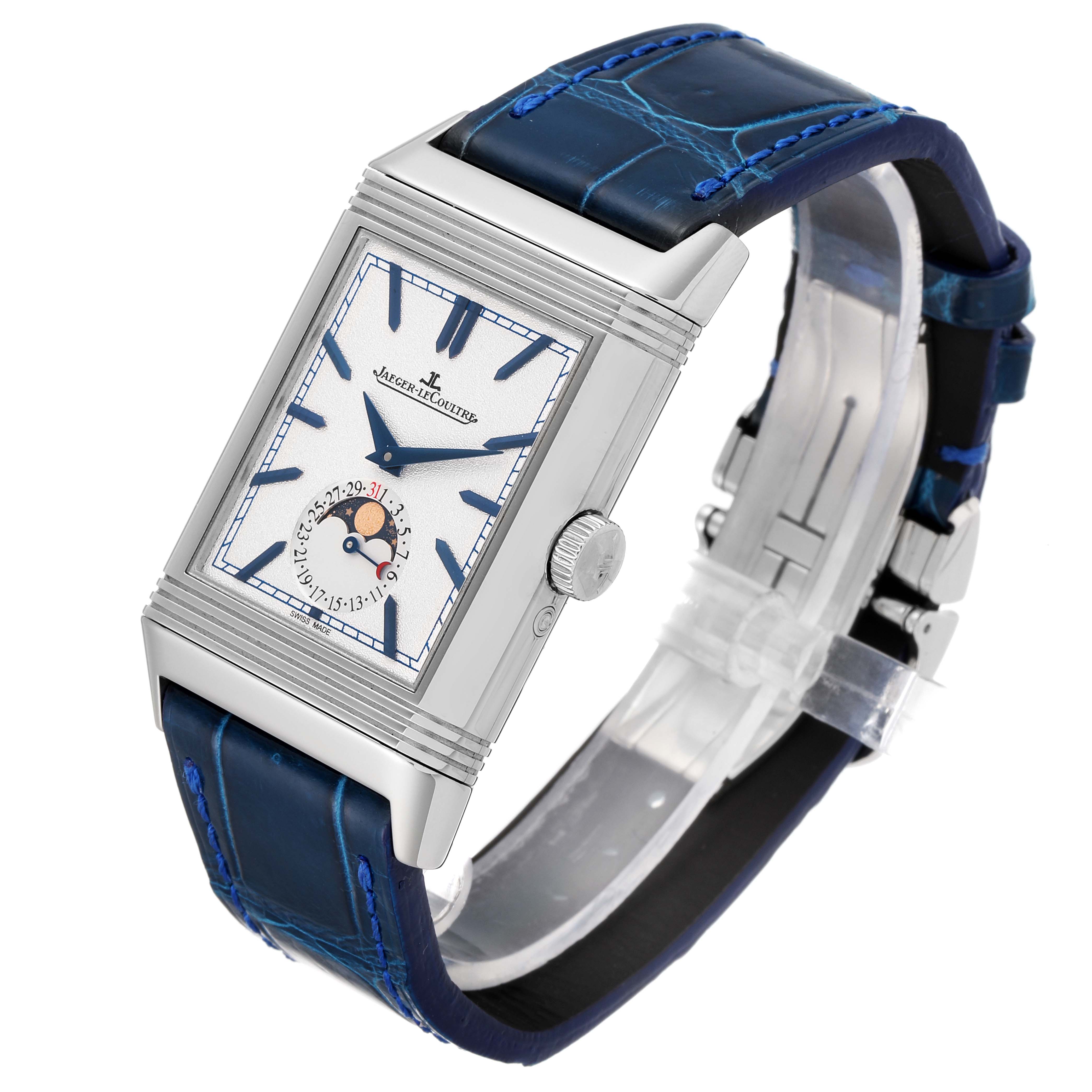 The Jaeger LeCoultre Reverso Q3958420 Men's Stainless Steel Blue Dial Q3958420 Men's Stainless Steel Blue Dial watch is shown at a slight angle from above, revealing its front face, case, and blue leather strap.