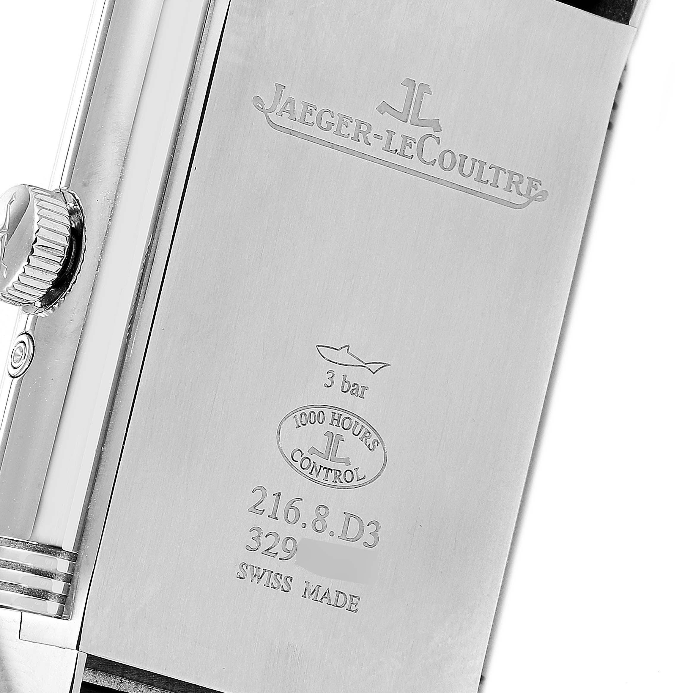 This image shows the back of a Jaeger-LeCoultre Reverso watch, highlighting its engravings and crown on the left side.