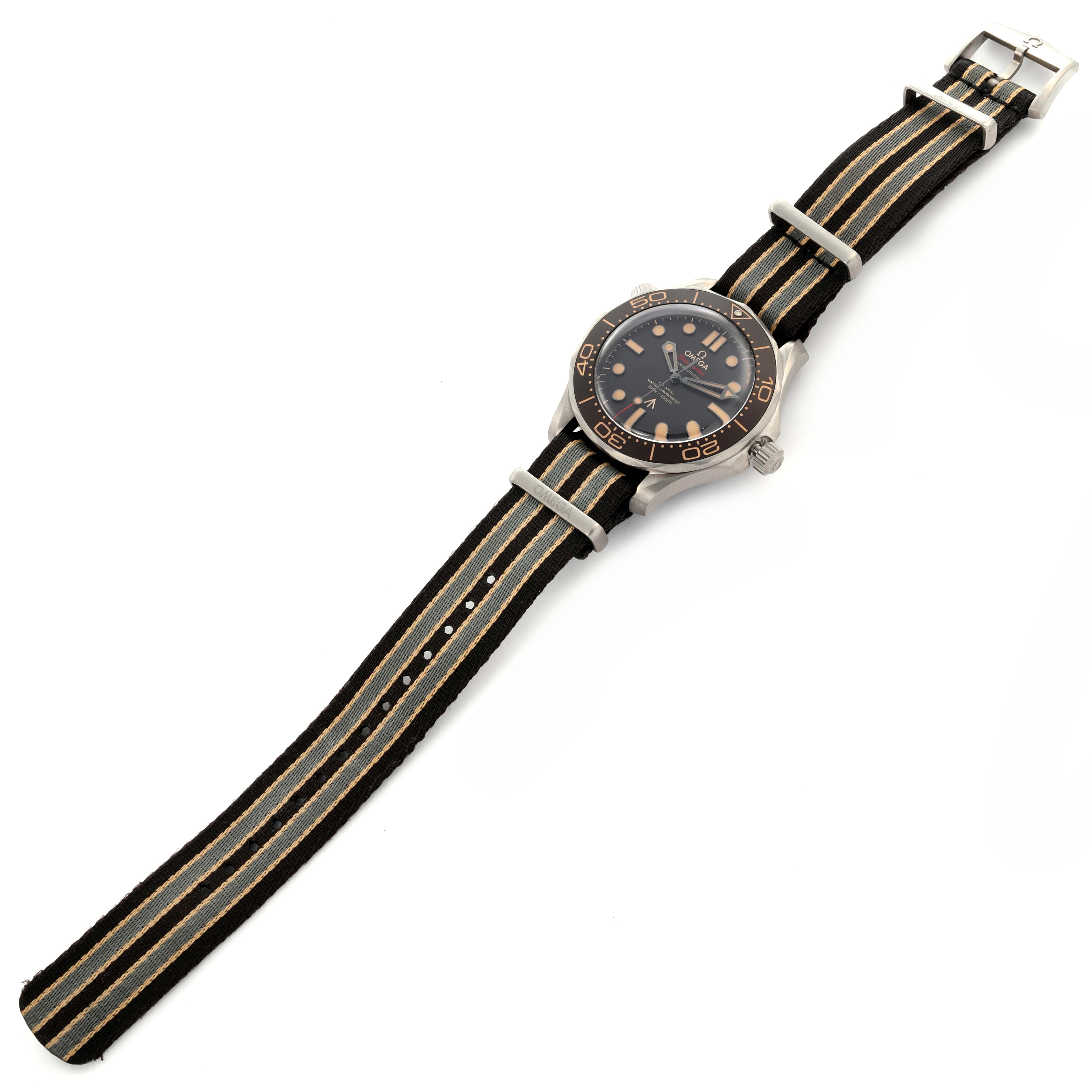 The Omega Seamaster 210.92.42.20.01.001 Men's Titanium Brown Dial 210.92.42.20.01.001 Men's Titanium Brown Dial watch is shown from a top-down angle featuring its face, bezel, and striped NATO strap.