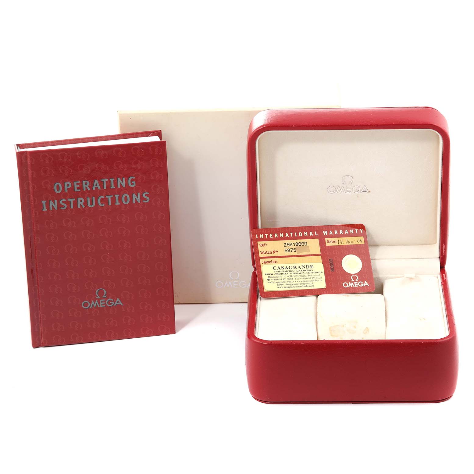 The image shows the accessories of an Omega Seamaster 2561.80.00 Men's Stainless Steel Blue Dial 2561.80.00 Men's Stainless Steel Blue Dial watch, including the operating instructions, a warranty card, and the watch box.