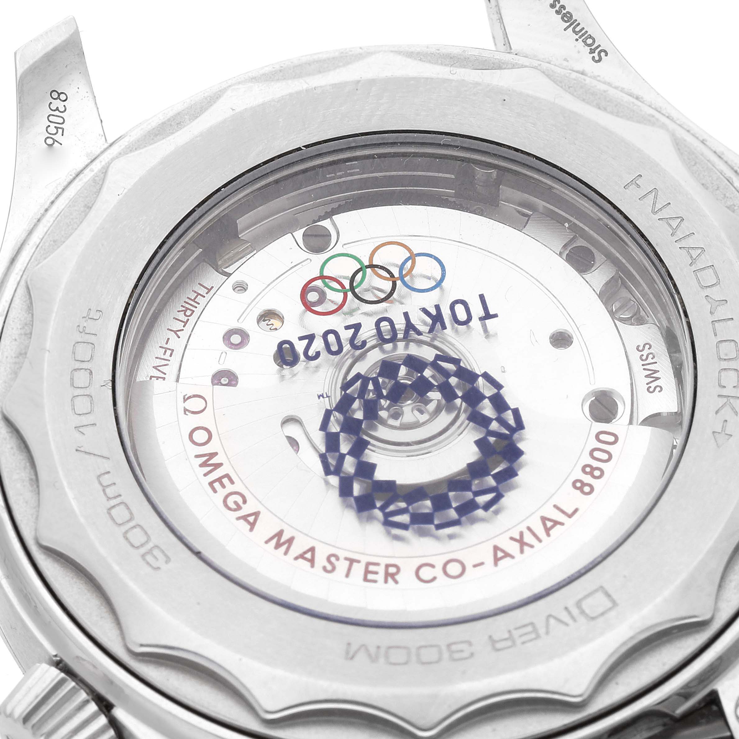 This image shows the case back of the Omega Seamaster 522.30.42.20.04.001 Men's Stainless Steel White Dial 522.30.42.20.04.001 Men's Stainless Steel White Dial model, highlighting the movement and Tokyo 2020 engraving.