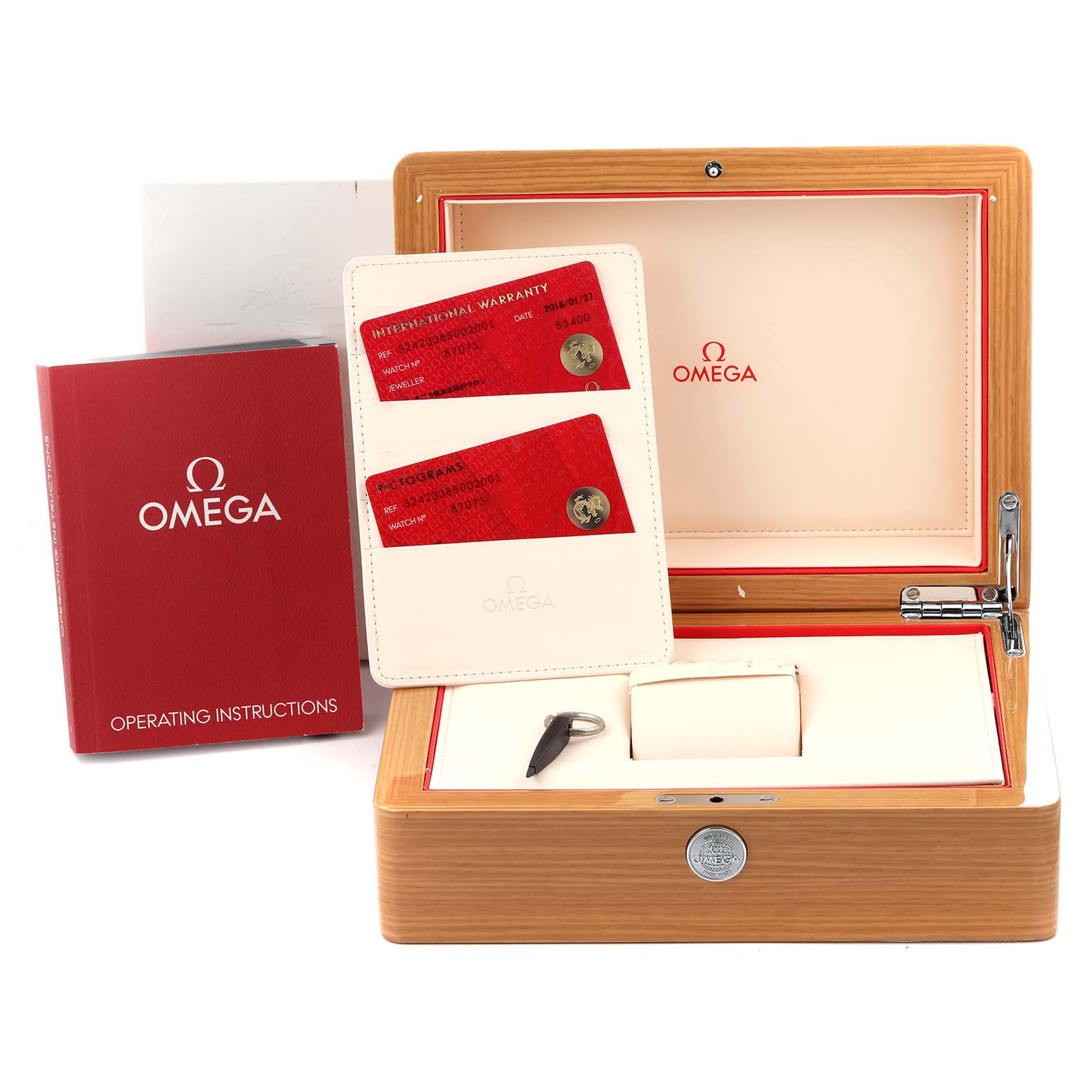 The image shows the wooden box and accessories of an Omega Speedmaster 324.23.38.50.02.001 Men's Steel and Gold (two tone) Silver Dial 324.23.38.50.02.001 Men's Steel and Gold (two tone) Silver Dial, including operating instructions and warranty cards.