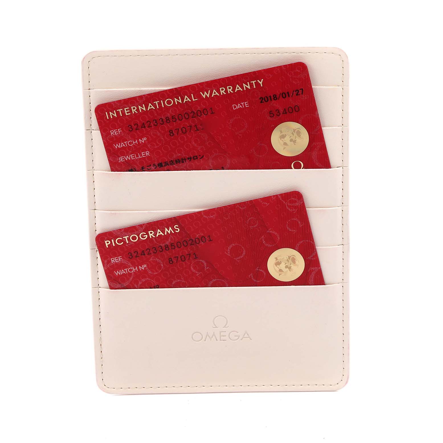 The image shows Omega Speedmaster 324.23.38.50.02.001 Men's Steel and Gold (two tone) Silver Dial 324.23.38.50.02.001 Men's Steel and Gold (two tone) Silver Dial warranty and pictogram cards in a cream-colored holder.