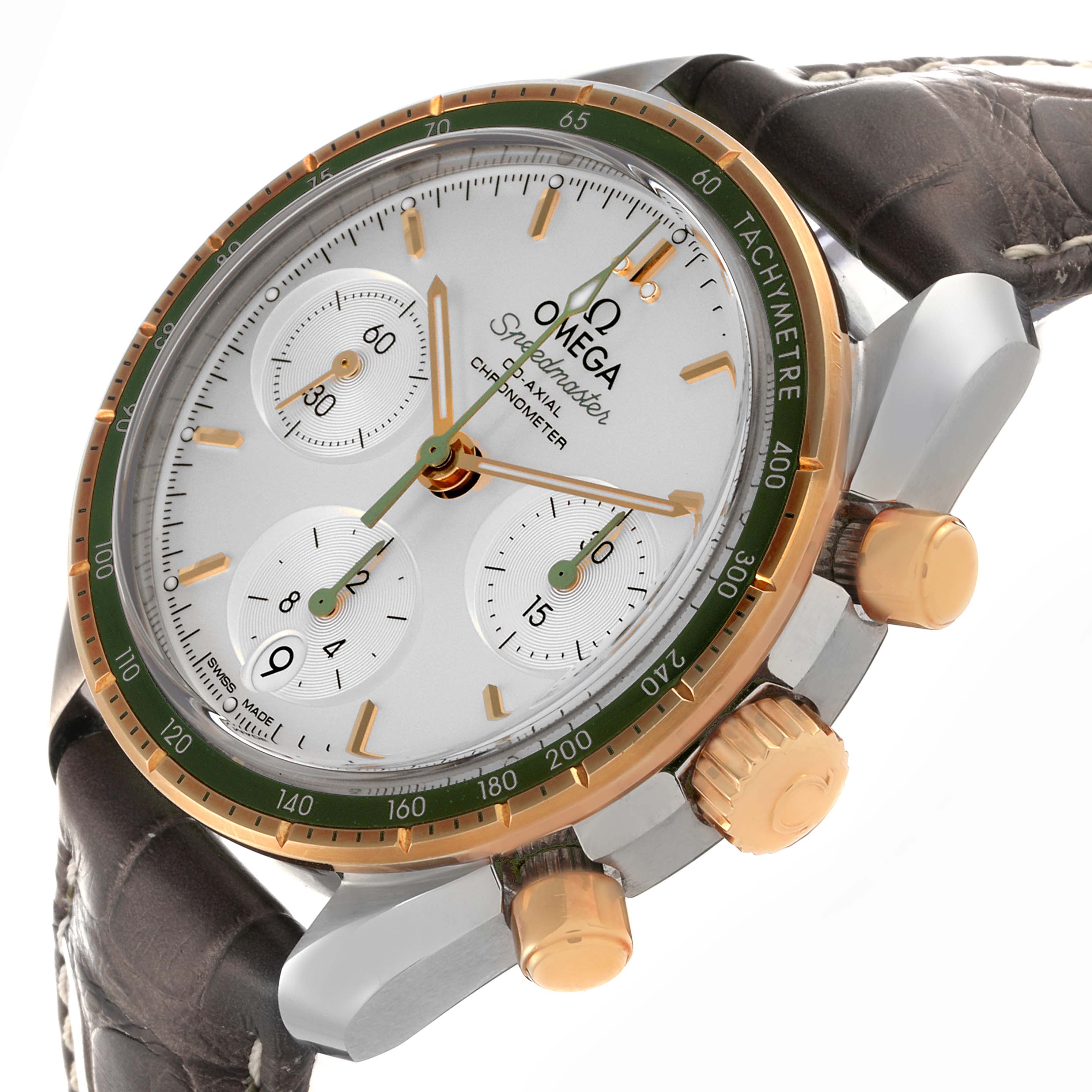The Omega Speedmaster 324.23.38.50.02.001 Men's Steel and Gold (two tone) Silver Dial 324.23.38.50.02.001 Men's Steel and Gold (two tone) Silver Dial is shown at a tilted angle, highlighting the watch face, bezel, subdials, pushers, and crown.