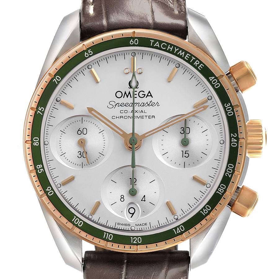 The Omega Speedmaster watch is shown from a front angle, highlighting the face, dials, and tachymeter bezel.