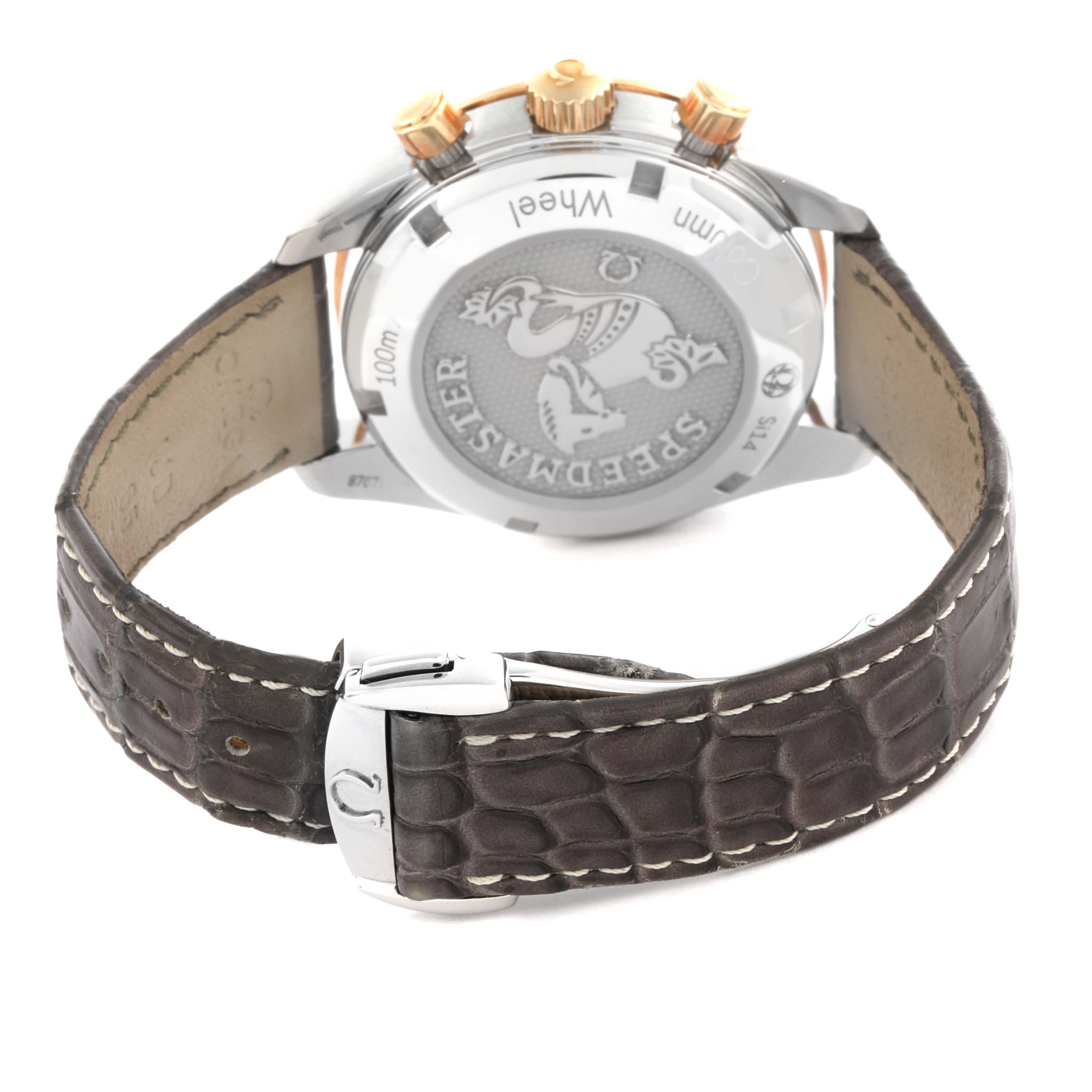 The Omega Speedmaster 324.23.38.50.02.001 Men's Steel and Gold (two tone) Silver Dial 324.23.38.50.02.001 Men's Steel and Gold (two tone) Silver Dial watch is shown from the back, displaying the case back and leather strap with a clasp.