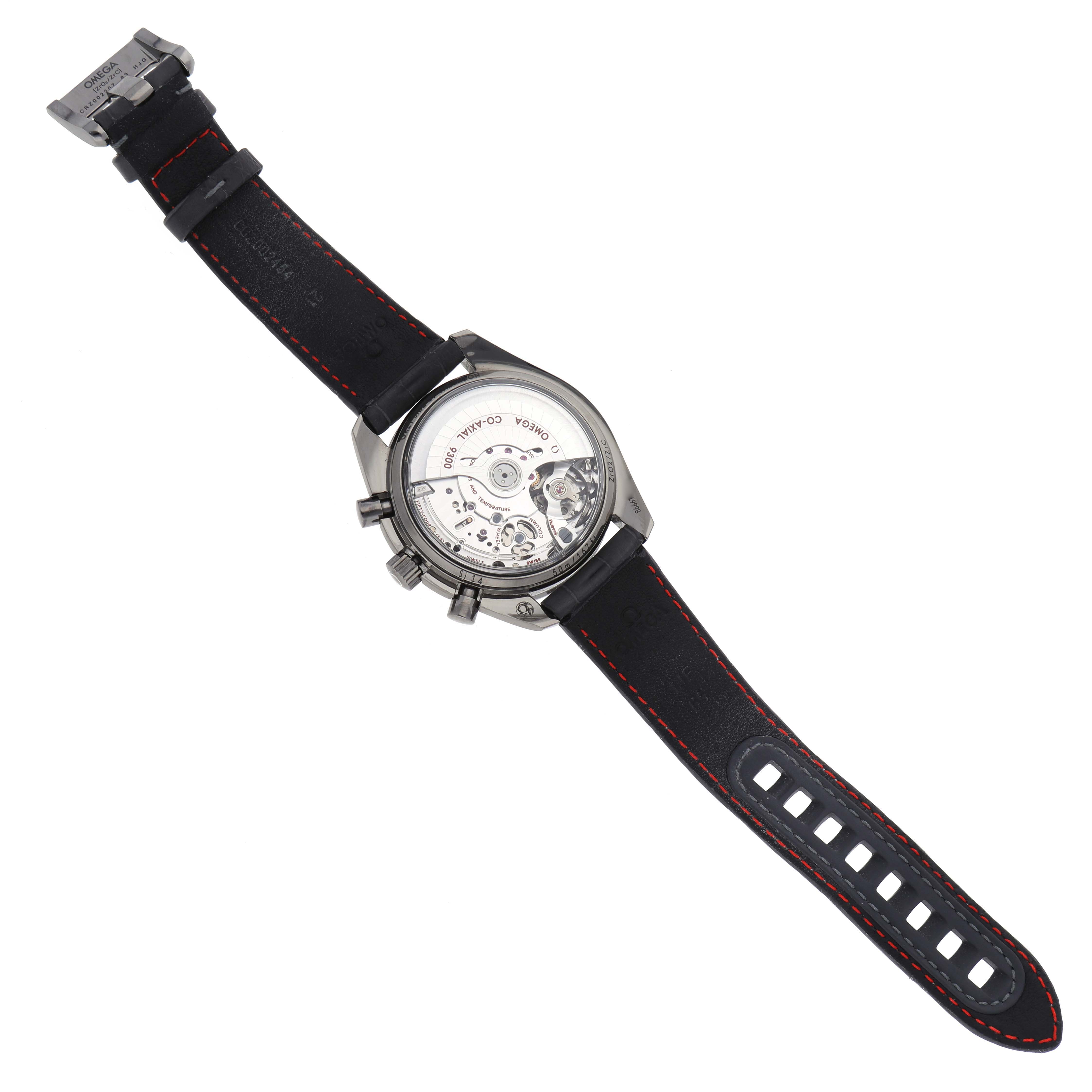 The Omega Speedmaster 311.93.44.51.99.001 Men's Ceramic Silver Dial 311.93.44.51.99.001 Men's Ceramic Silver Dial watch is shown from the back, highlighting its transparent case back and movement, with a black strap.