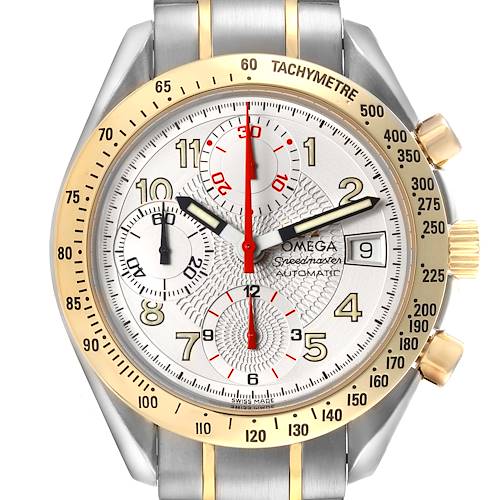 The Omega Speedmaster watch is shown from the front, highlighting the dial, bezel, and bracelet.