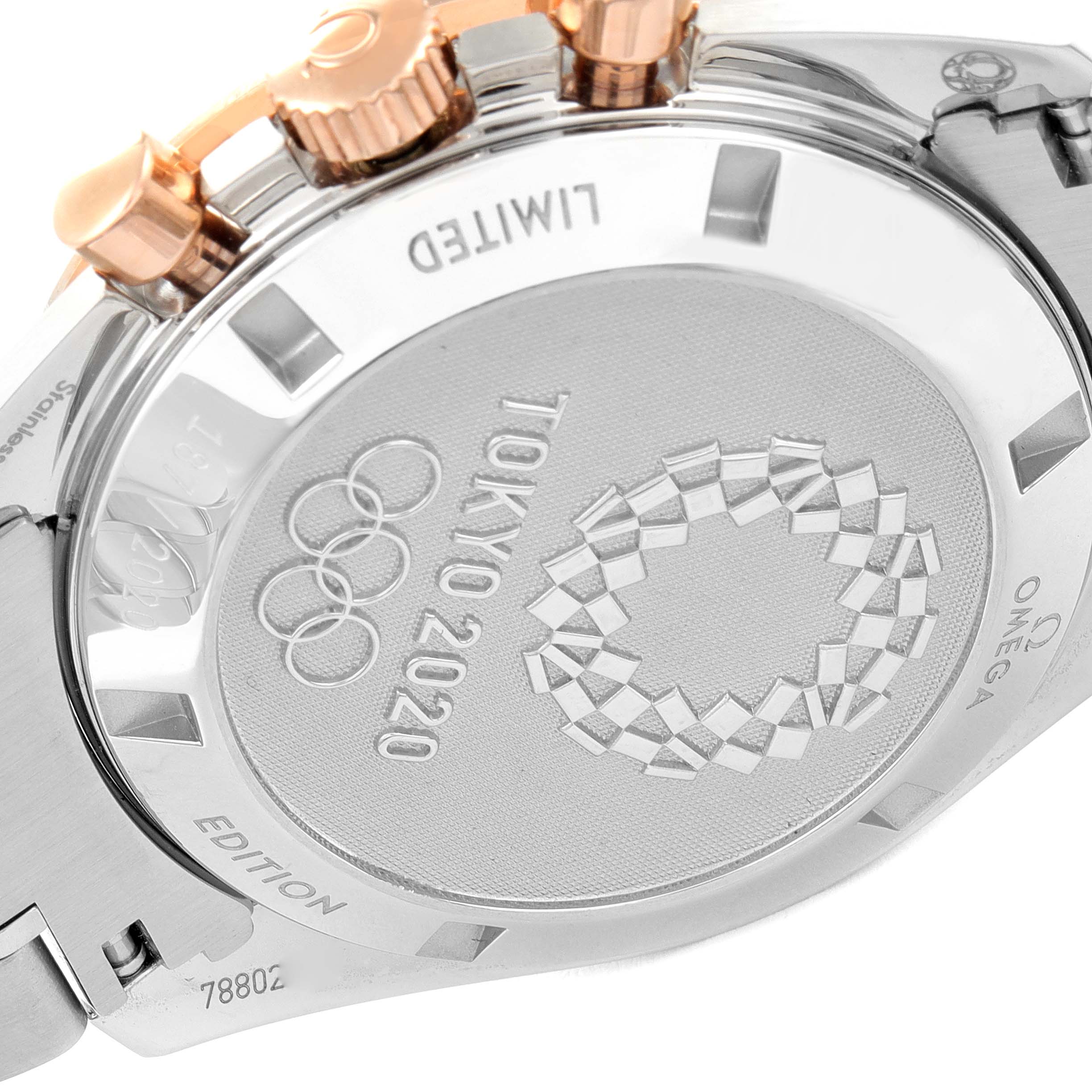 The image shows the back case of an Omega Speedmaster 522.20.42.30.06.001 Men's Steel and Gold (two tone) Grey Dial 522.20.42.30.06.001 Men's Steel and Gold (two tone) Grey Dial watch, featuring the Tokyo 2020 Olympics limited edition engraving.