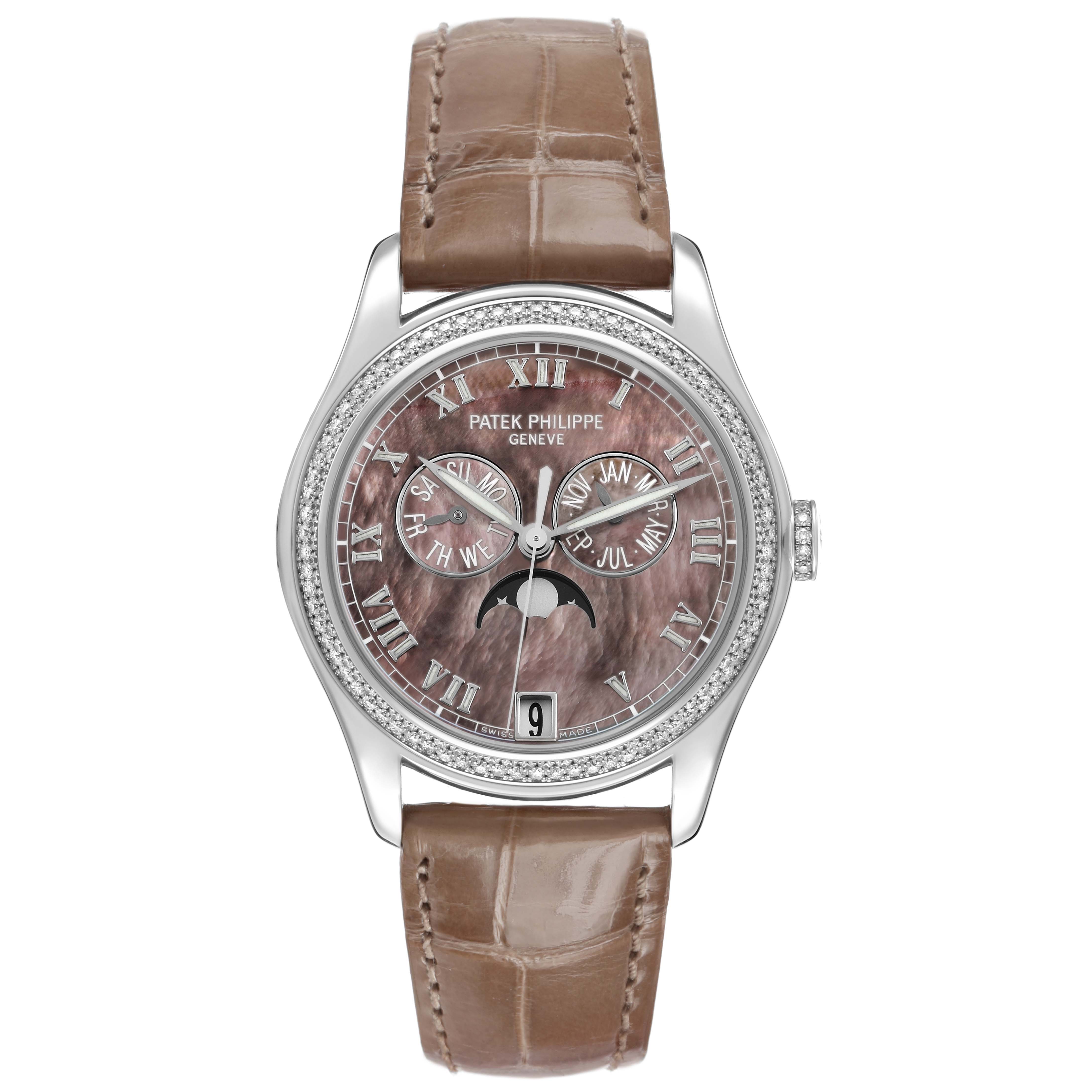 The Patek Philippe Complications 4936 Men's White Gold Mother of Pearl Dial watch is shown from a top-down angle, highlighting the face, bezel, and strap.
