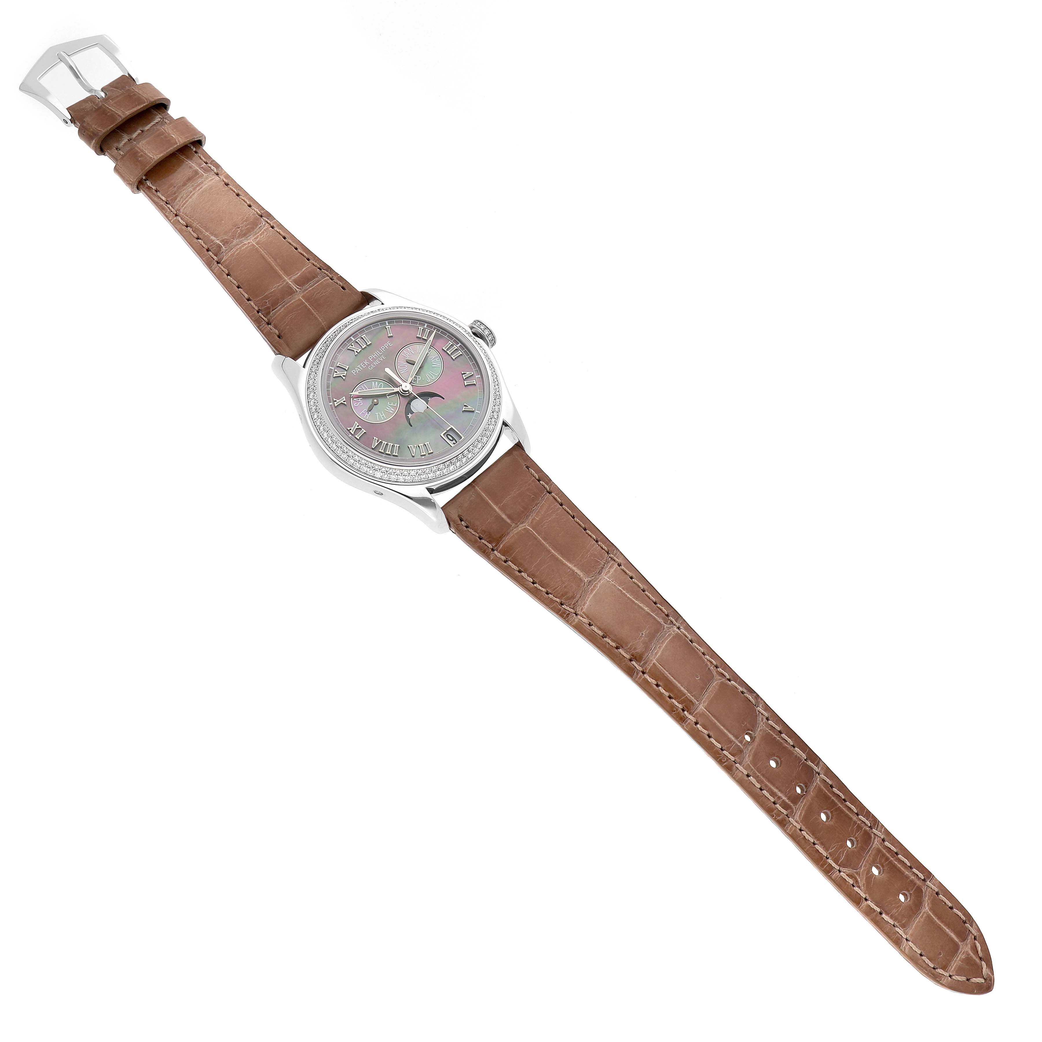 The Patek Philippe Complications 4936 Men's White Gold Mother of Pearl Dial watch is shown at a top-down angle, displaying the full face, case, and strap.