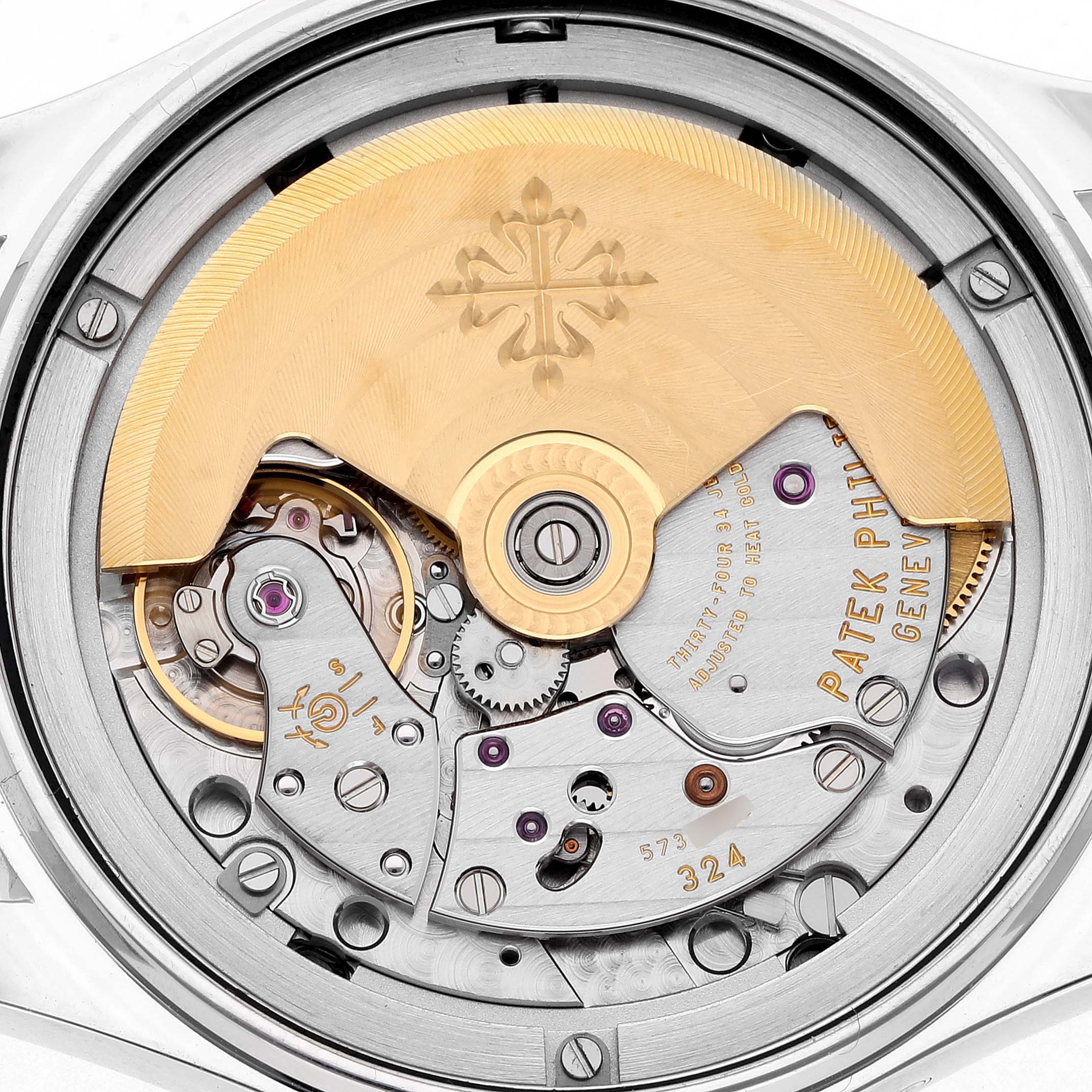 The image shows the back view of a Patek Philippe Complications 4936 Men's White Gold Mother of Pearl Dial model, highlighting the movement and rotor.