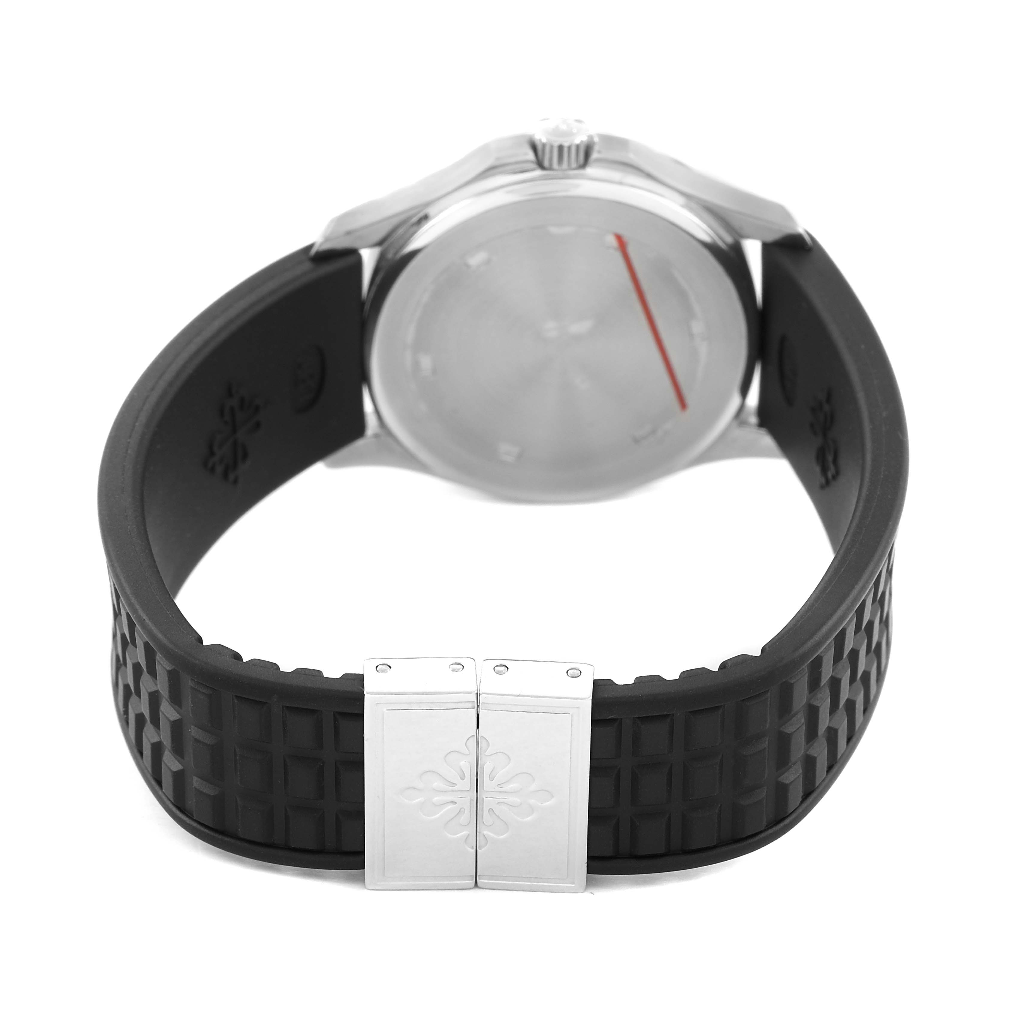 The Patek Philippe Aquanaut 4960/1A-001 Women's Stainless Steel Black Dial watch is shown from the back, highlighting the clasp and rubber strap detailing.