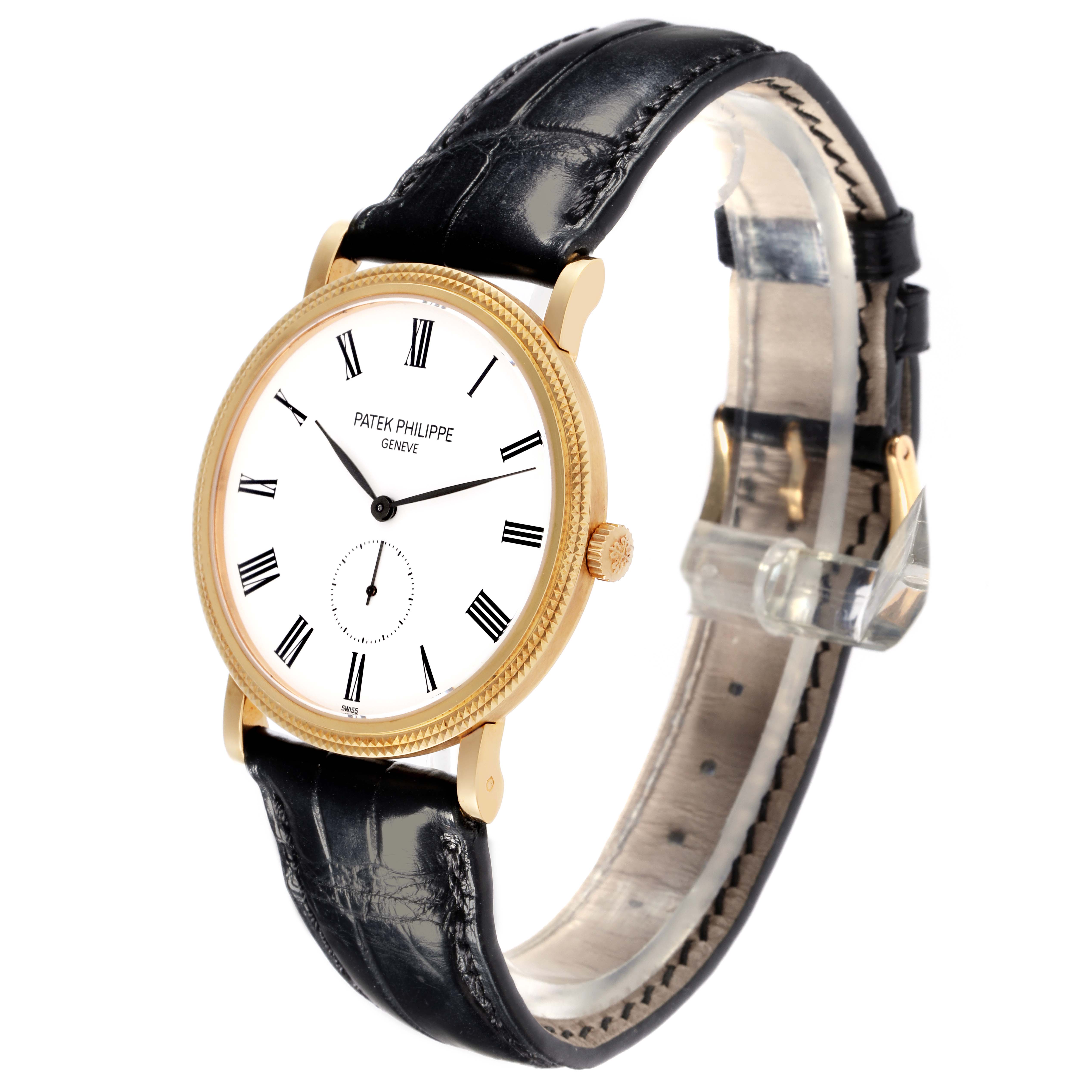 The Patek Philippe Calatrava 5119J Men's Yellow Gold White Dial 5119J Men's Yellow Gold White Dial watch is shown at a three-quarter angle, highlighting the face, crown, and leather strap.