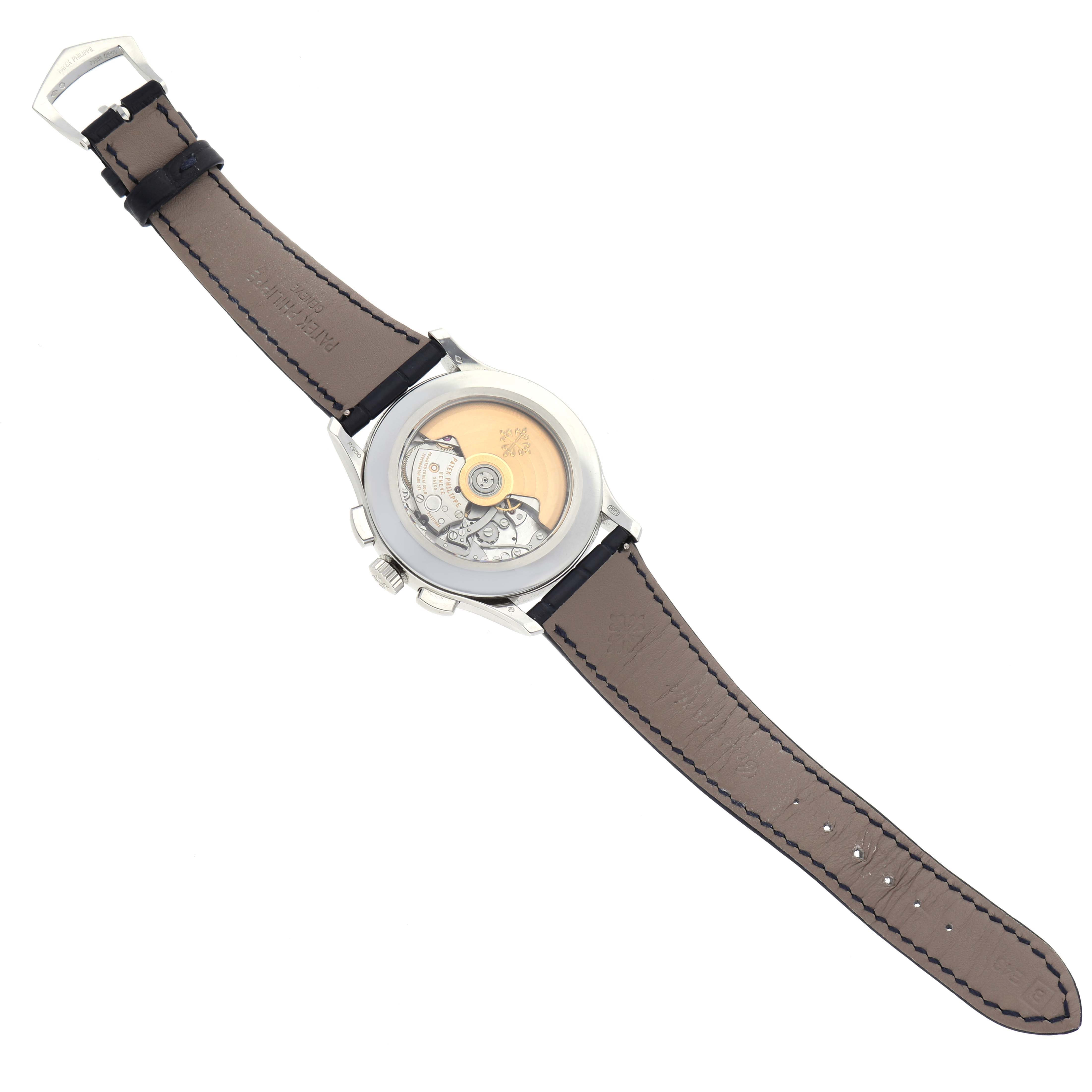The image shows the back of the Patek Philippe Complications 5905P - 001 Men's Platinum Blue Dial 5905P - 001 Men's Platinum Blue Dial watch, displaying its movement and leather strap.