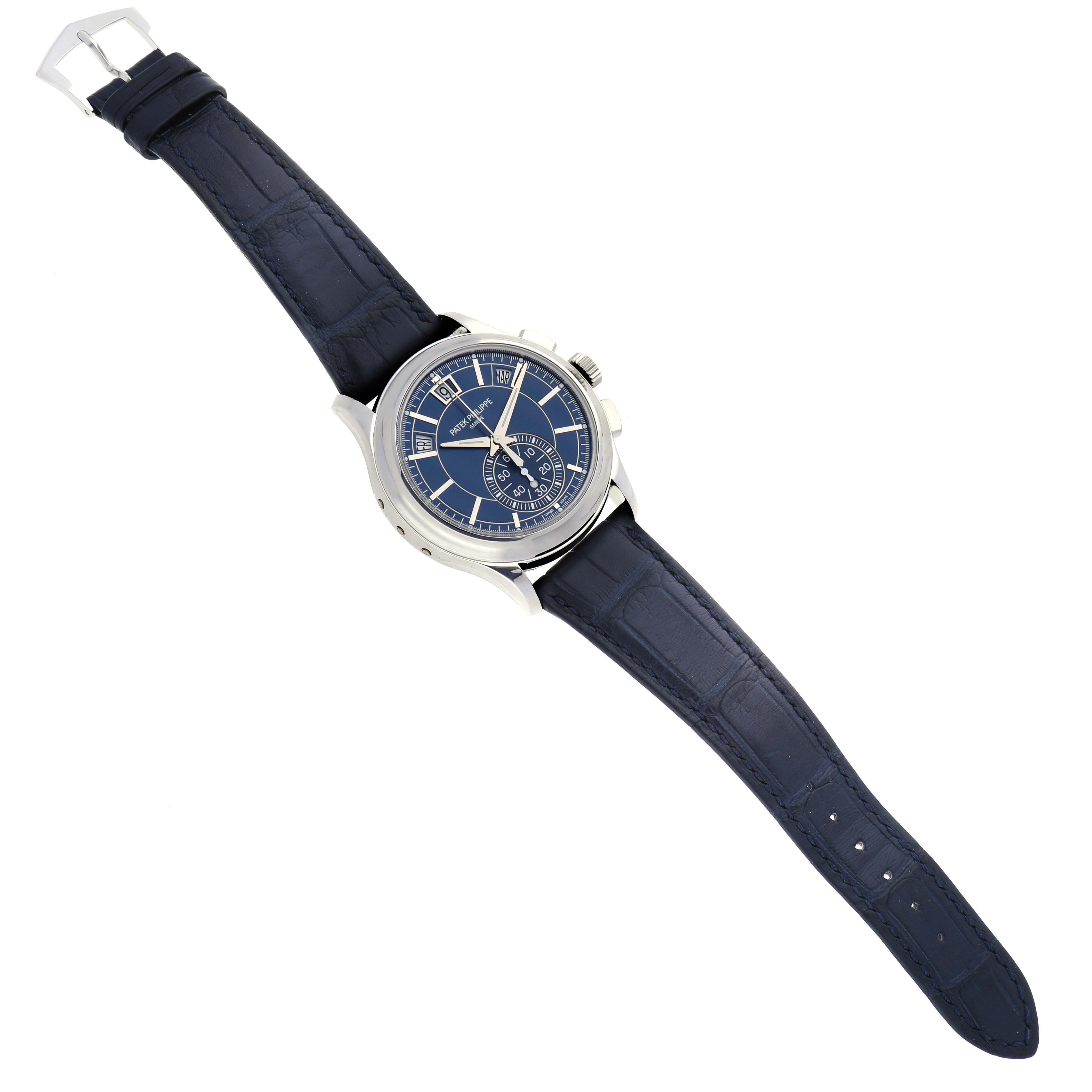The Patek Philippe Complications 5905P - 001 Men's Platinum Blue Dial 5905P - 001 Men's Platinum Blue Dial watch is shown at a slight angle, displaying its dial, case, and full leather strap.