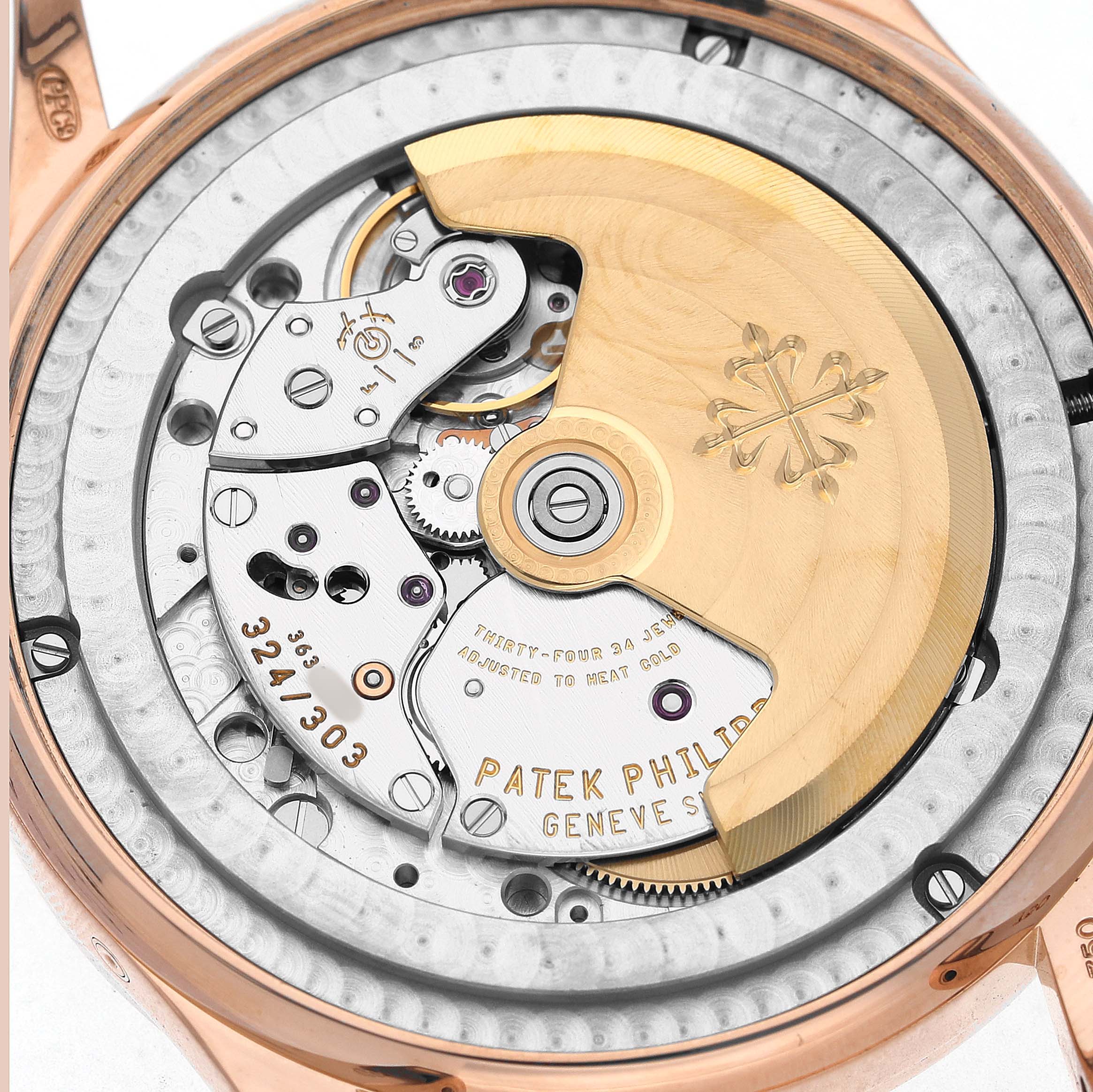 The image shows the intricate back view of the Patek Philippe Complications 5396R-001 Men's Rose Gold Silver Dial watch, highlighting its movement and rotor.