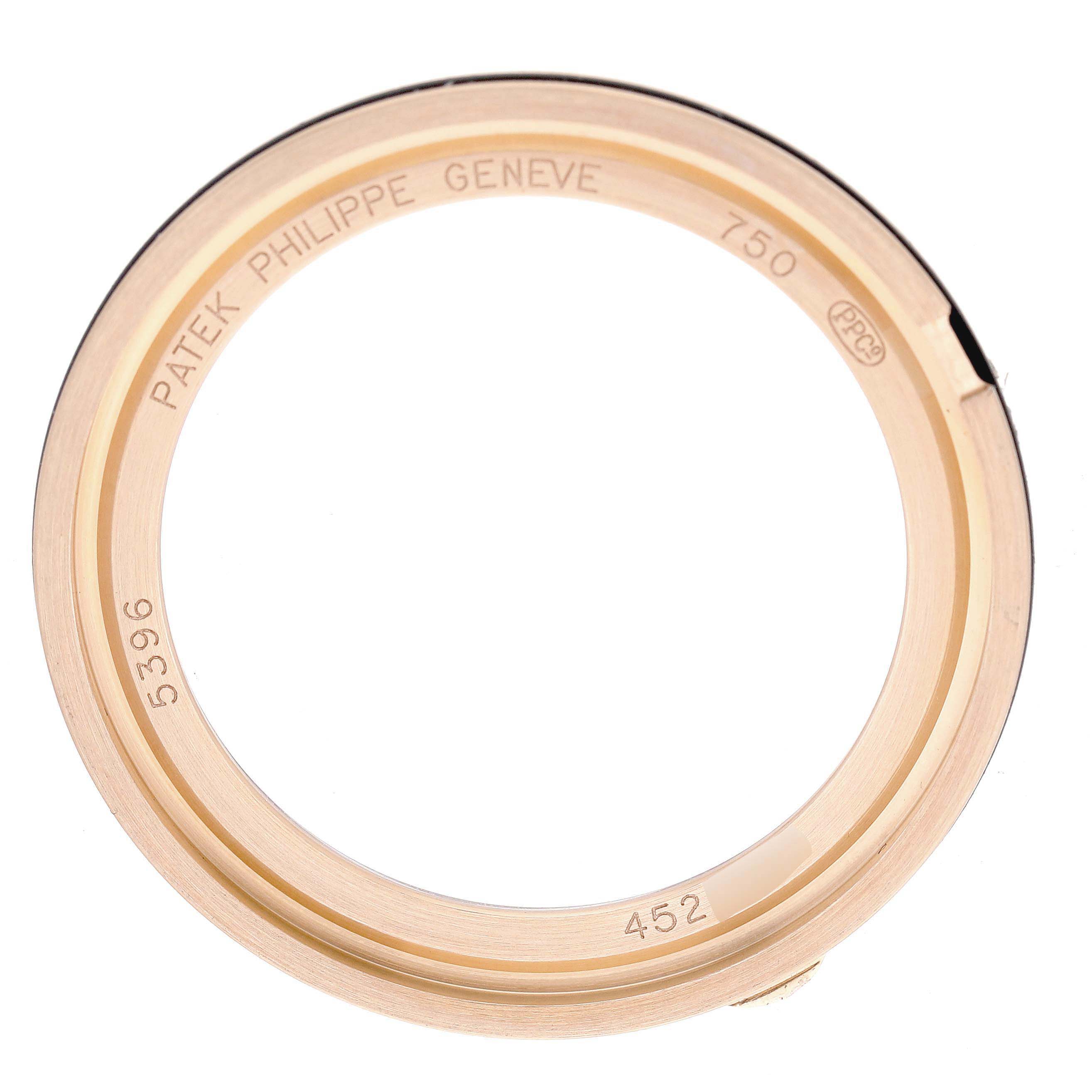 The image shows a bezel for a Patek Philippe Complications 5396R Men's Rose Gold Silver Dial model, viewed from above to highlight engravings.