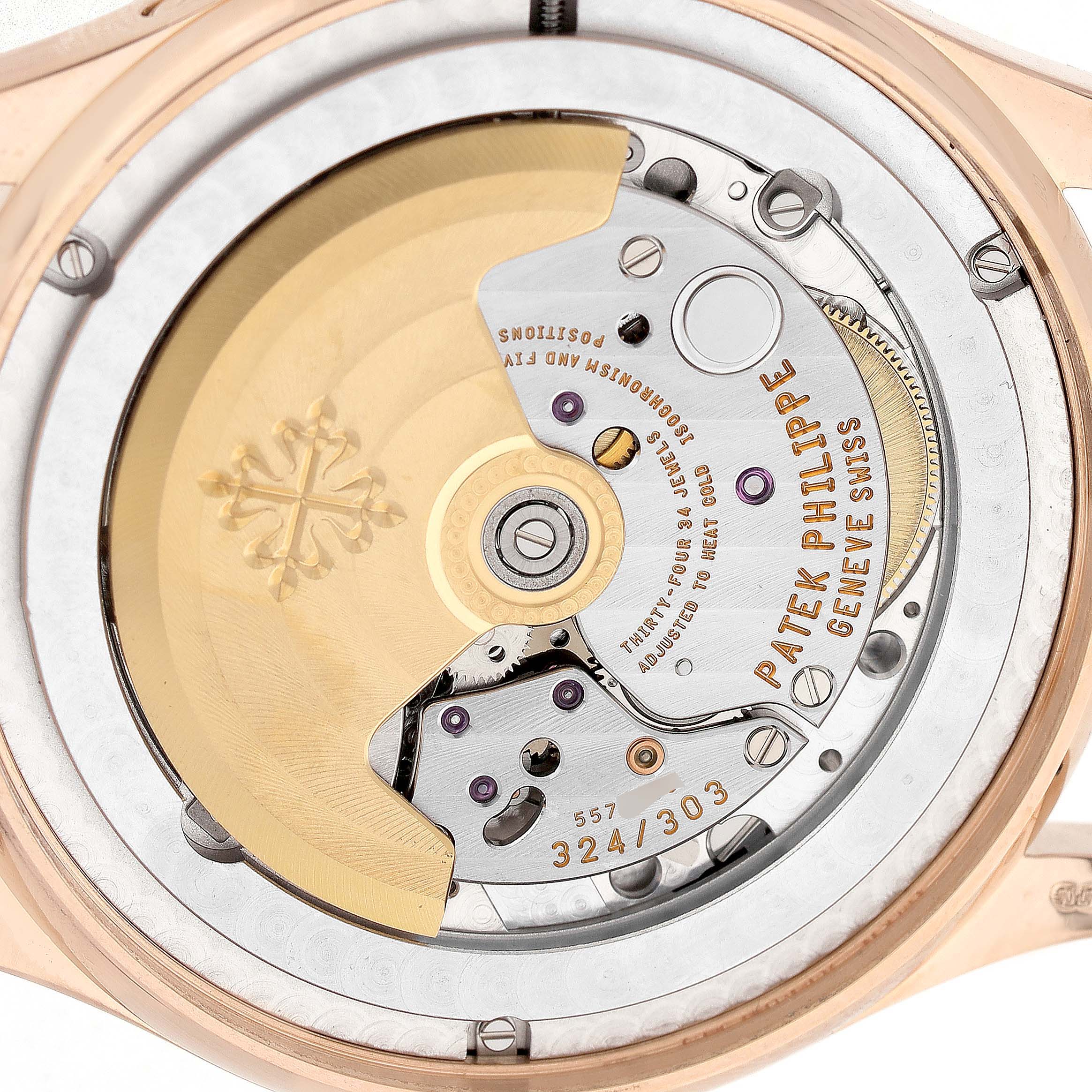 The image shows the back movement of a Patek Philippe Complications 5396R Men's Rose Gold Silver Dial watch, highlighting its intricate mechanical components and rotor.