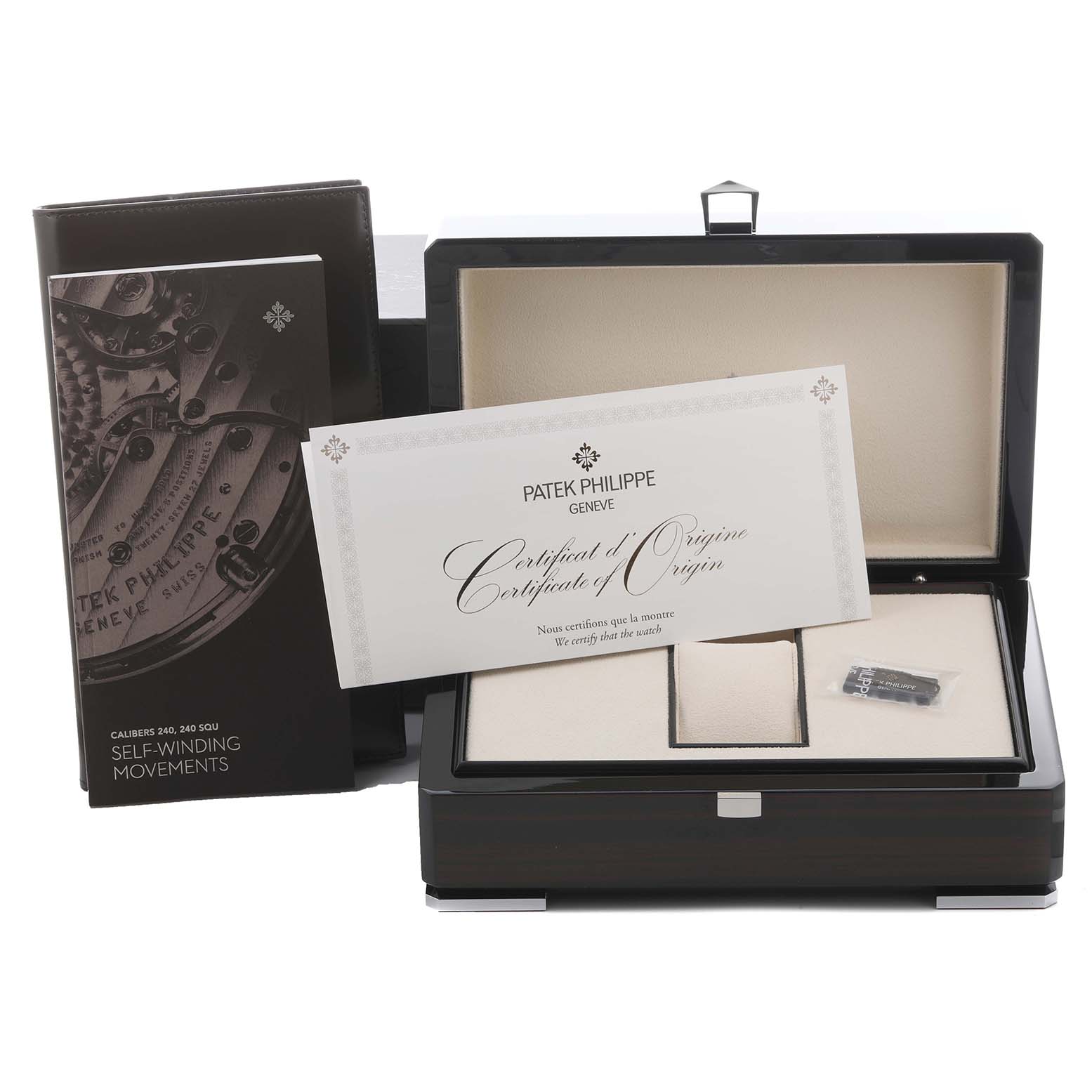 The image shows the Patek Philippe Golden Ellipse 5738P-001 Men's Platinum Blue Dial 5738P-001 Men's Platinum Blue Dial watch box, certificate of origin, and manual from a front angle.