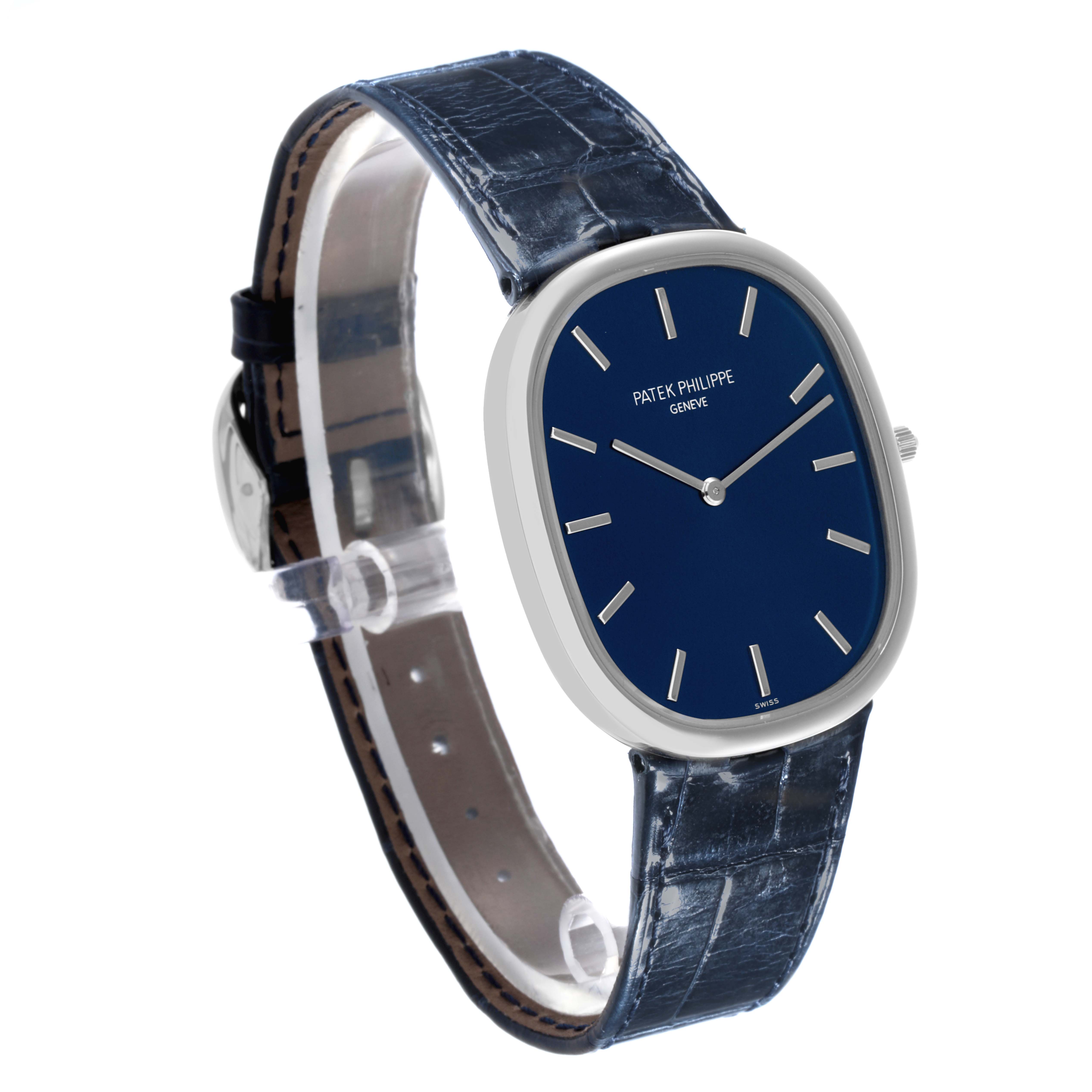 The Patek Philippe Golden Ellipse 5738P-001 Men's Platinum Blue Dial 5738P-001 Men's Platinum Blue Dial watch is shown from a 3/4 angle, highlighting the blue dial, silver markers, and leather strap.