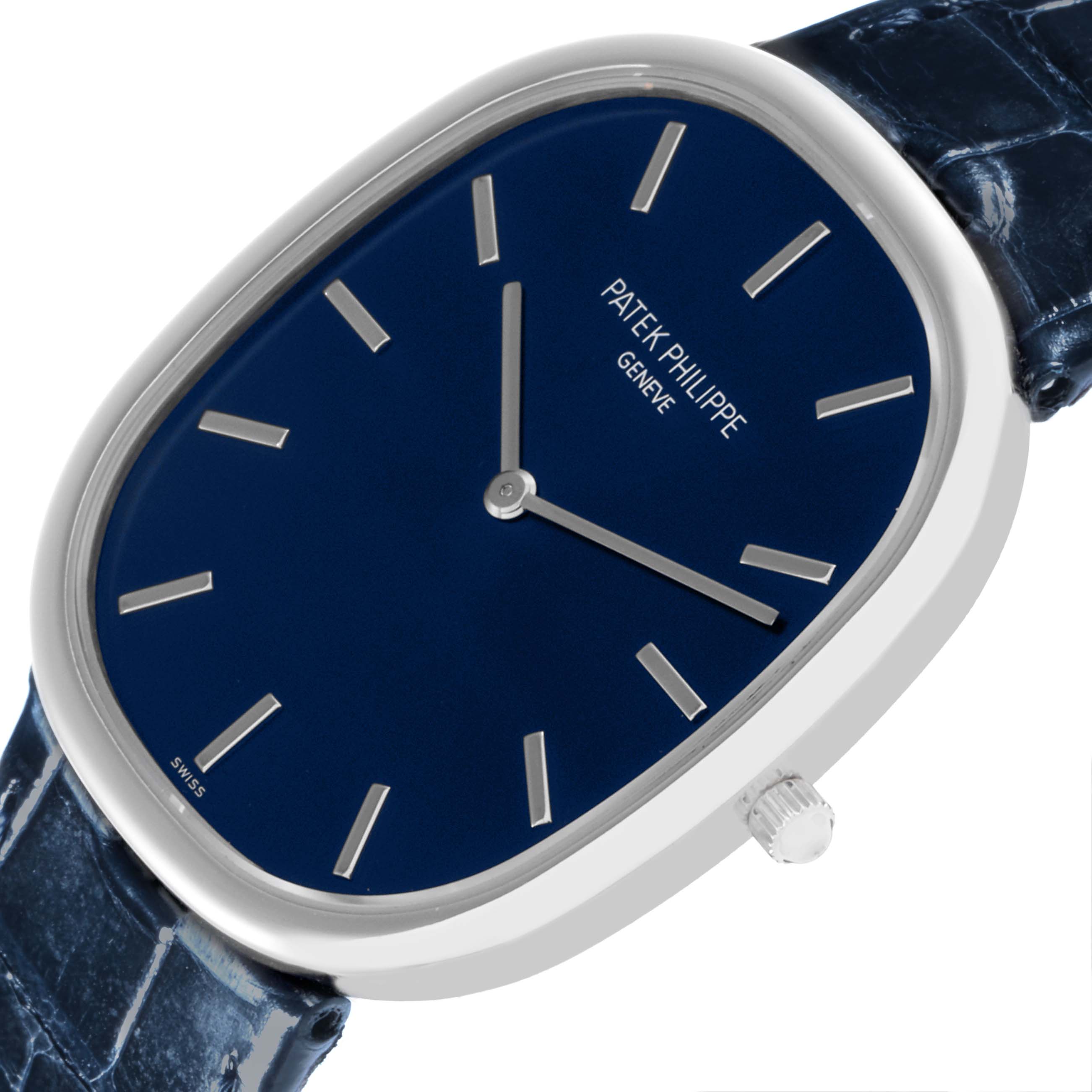 This image shows a Patek Philippe Golden Ellipse 5738P-001 Men's Platinum Blue Dial 5738P-001 Men's Platinum Blue Dial watch at an angled view, highlighting its blue dial, case, crown, and strap.