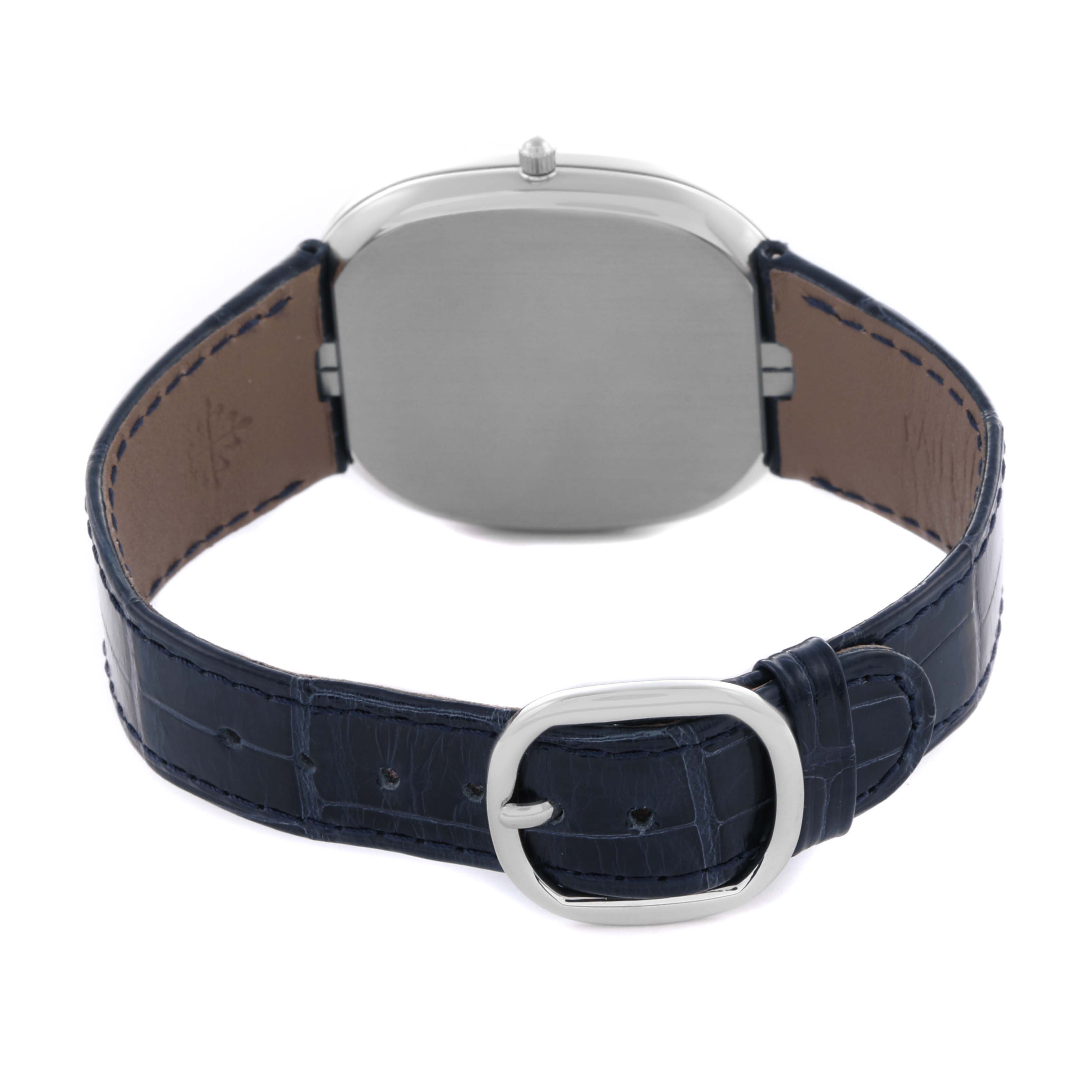 The image shows the back of the Patek Philippe Golden Ellipse 5738P-001 Men's Platinum Blue Dial 5738P-001 Men's Platinum Blue Dial watch, focusing on the case back and leather strap with a buckle.