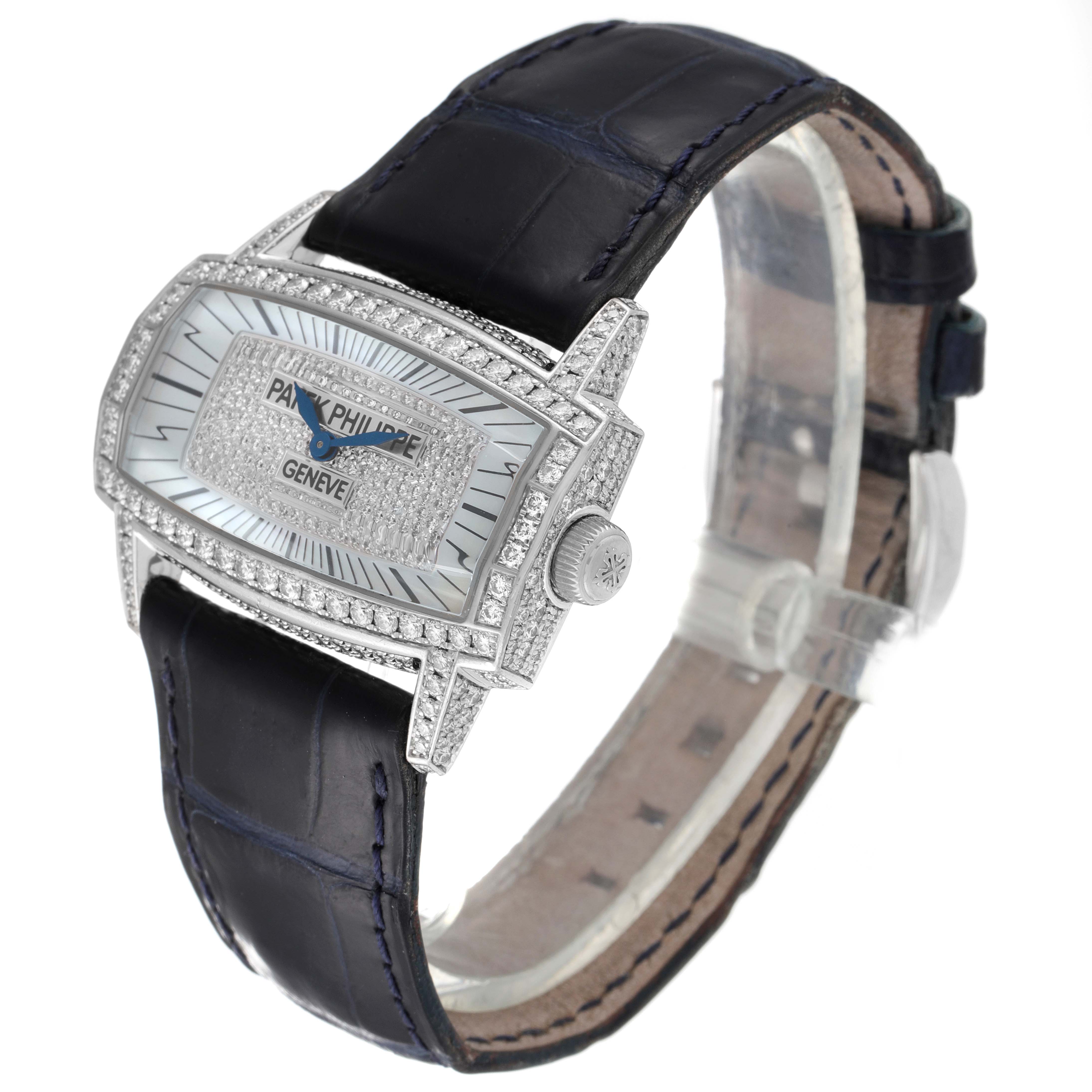 The Patek Philippe Gondolo 4992G Women's White Gold Mother of Pearl Dial 4992G Women's White Gold Mother of Pearl Dial watch is shown at an angled view, highlighting its diamond-encrusted face and leather strap.