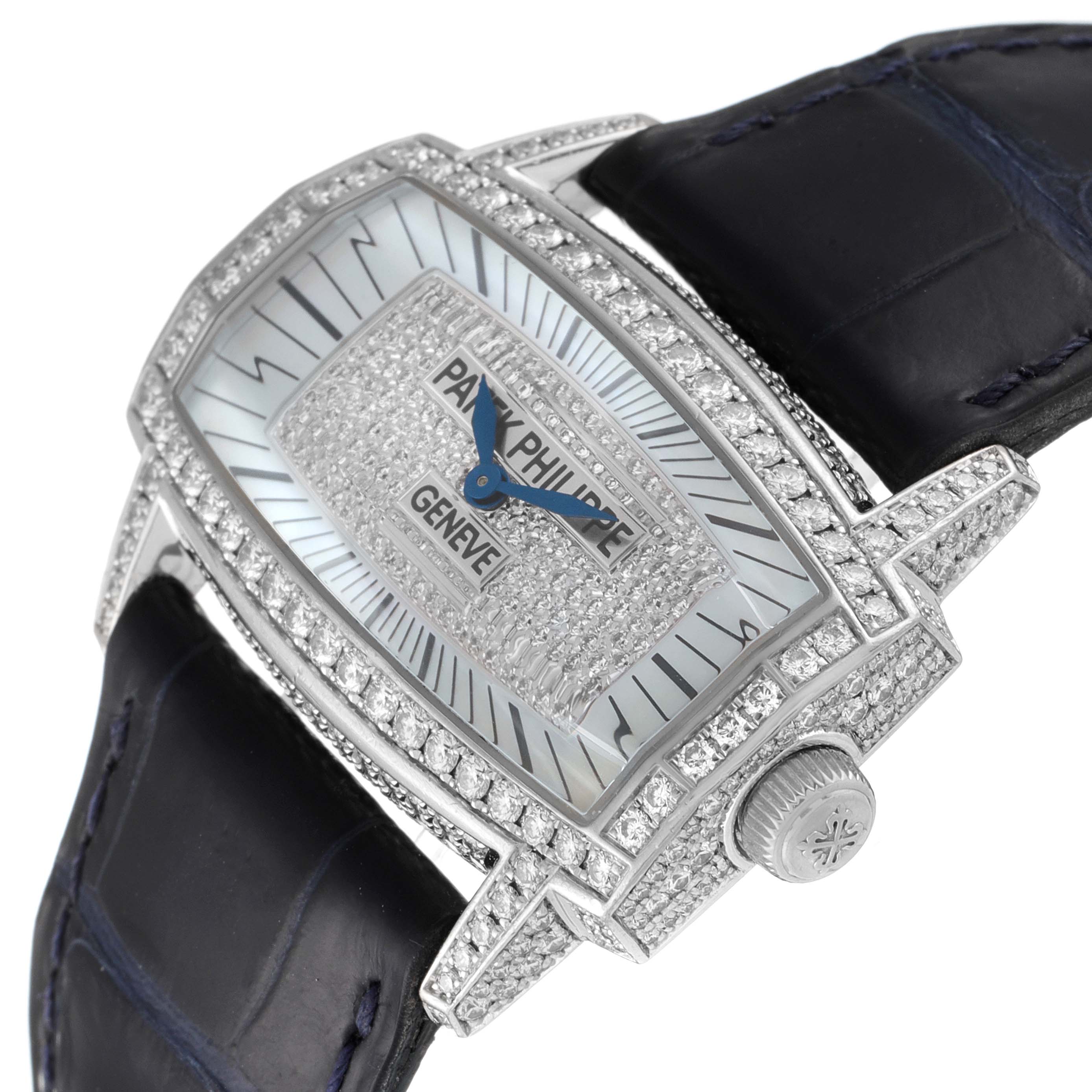 The image shows a Patek Philippe Gondolo 4992G Women's White Gold Mother of Pearl Dial 4992G Women's White Gold Mother of Pearl Dial watch at an angle, highlighting its diamond-studded case, dial, and leather strap.
