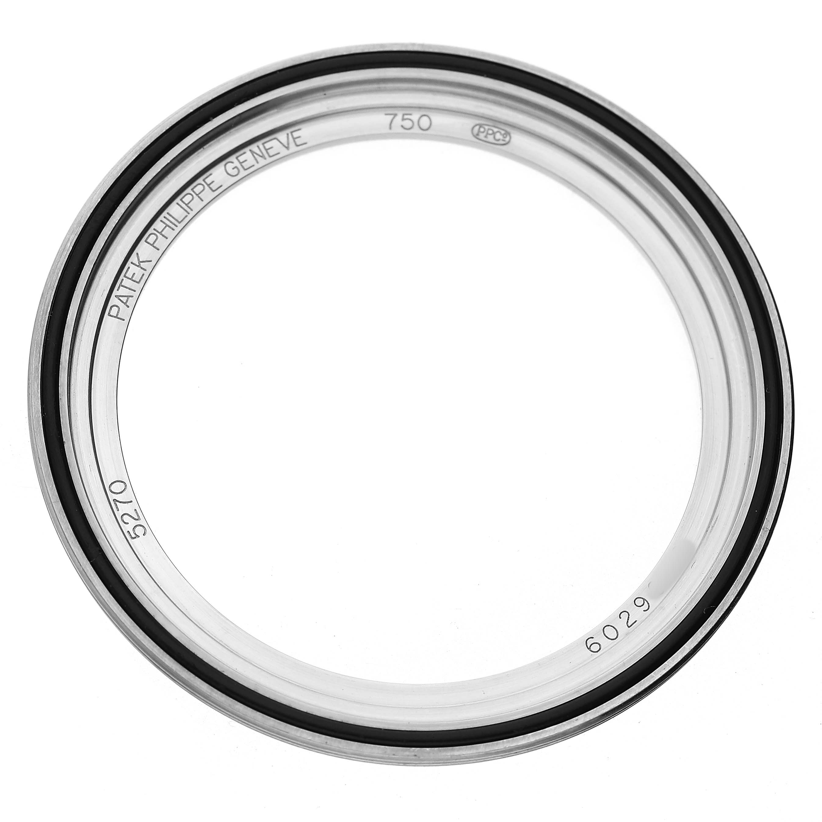 The image shows a bezel or part of a watch case of the Patek Philippe Complications 5270 Men's White Gold Silver Dial model, viewed from above.