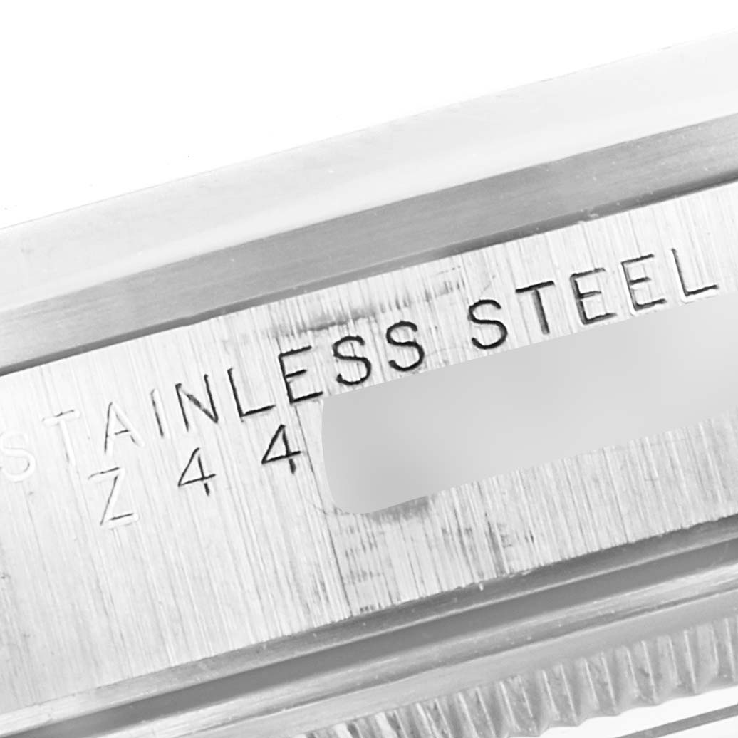 The image shows a close-up of the stainless steel casing and part of the bezel of a Rolex Air-King 14000 Men's Stainless Steel Pink Dial 14000 Men's Stainless Steel Pink Dial watch.