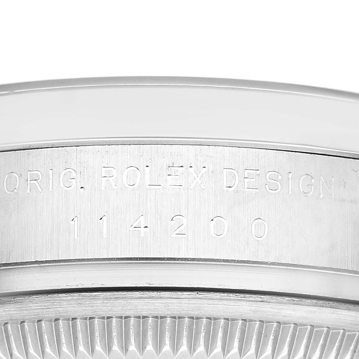 The image shows the side view of a Rolex Air-King 114200 Men's Stainless Steel White Dial watch case, highlighting the engraved model number.