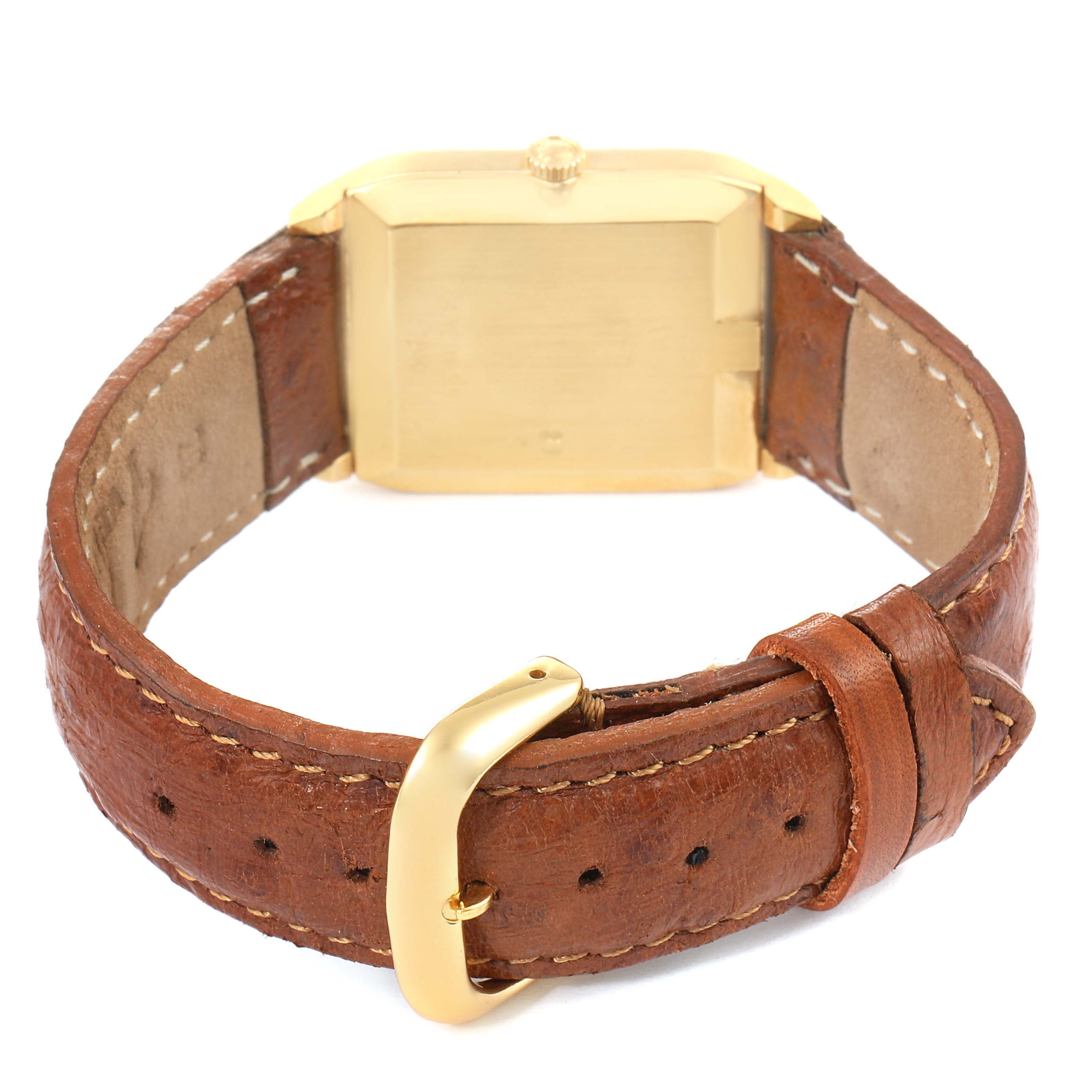 The image shows the back view of a Vintage Collection Rolex watch with a brown leather strap and gold buckle.