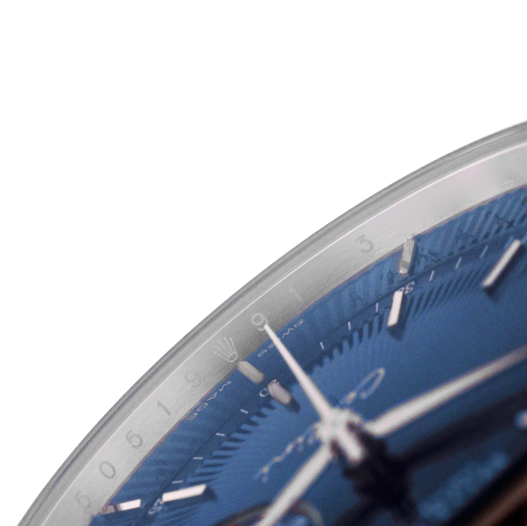 The image shows a close-up, angled view of the Rolex Cellini 50519 Men's White Gold Blue Dial dial, focusing on the hour markers and hands.