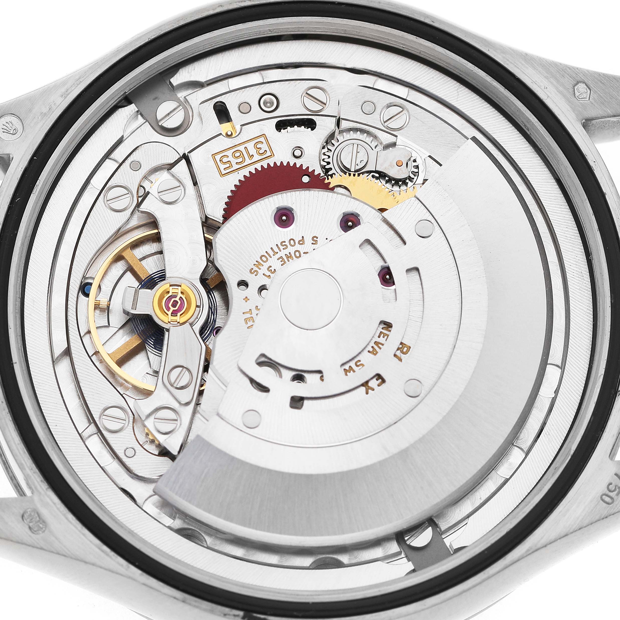 The image shows the movement of a Rolex Cellini 50519 Men's White Gold Blue Dial watch from an overhead angle, featuring gears and the oscillating weight.
