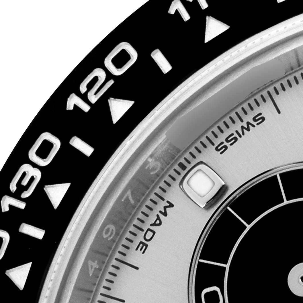 The image shows a close-up of the bezel and part of the dial of a Rolex Daytona 116519LN Men's White Gold Silver Dial 116519LN Men's White Gold Silver Dial watch.