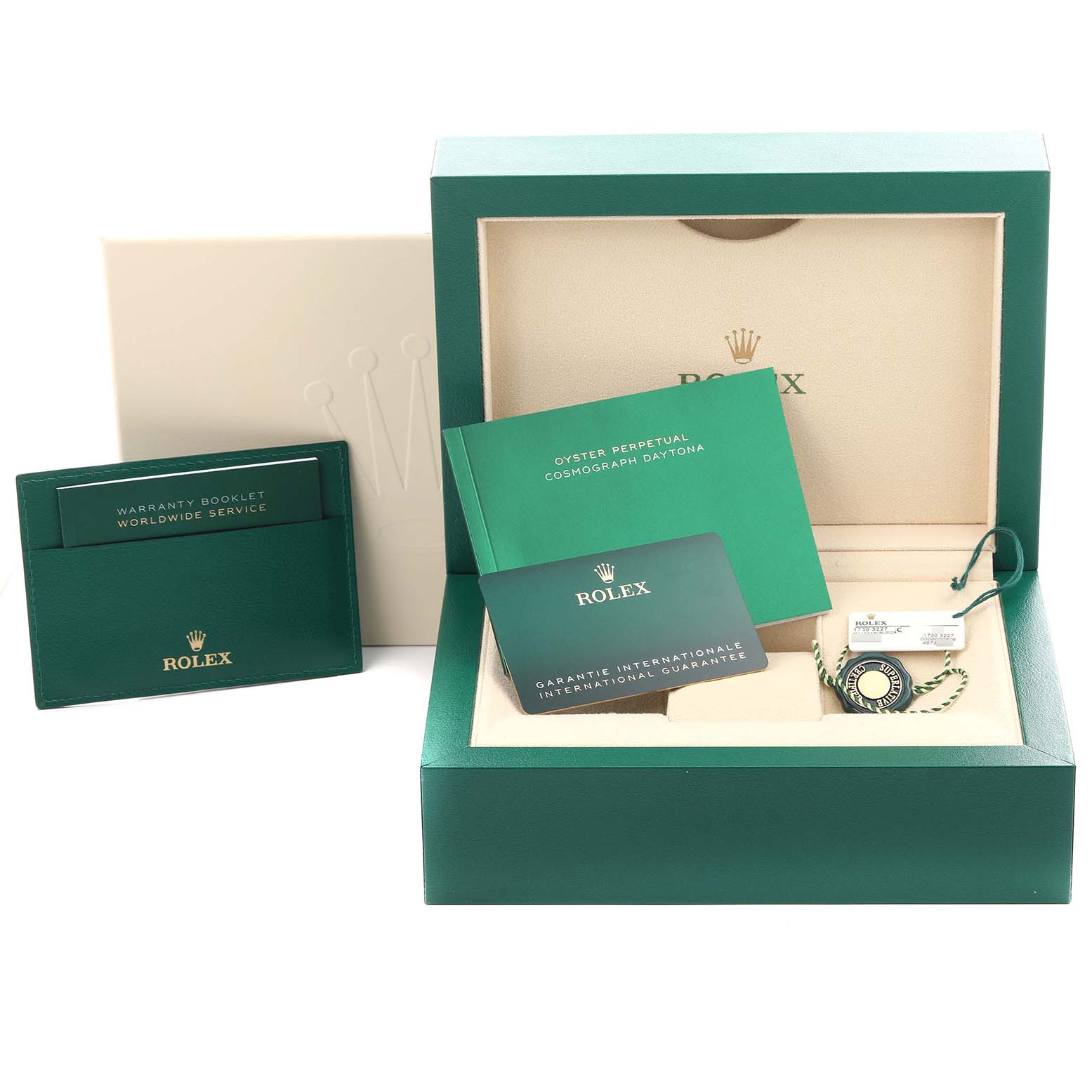 The image shows a Rolex Daytona 116519LN Men's White Gold Silver Dial 116519LN Men's White Gold Silver Dial watch box set, including booklets, a warranty card, and a hang tag, viewed from the front.