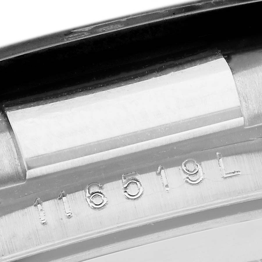 The image shows a close-up of the inner case, displaying the serial number of a Rolex Daytona 116519LN Men's White Gold Silver Dial 116519LN Men's White Gold Silver Dial watch.
