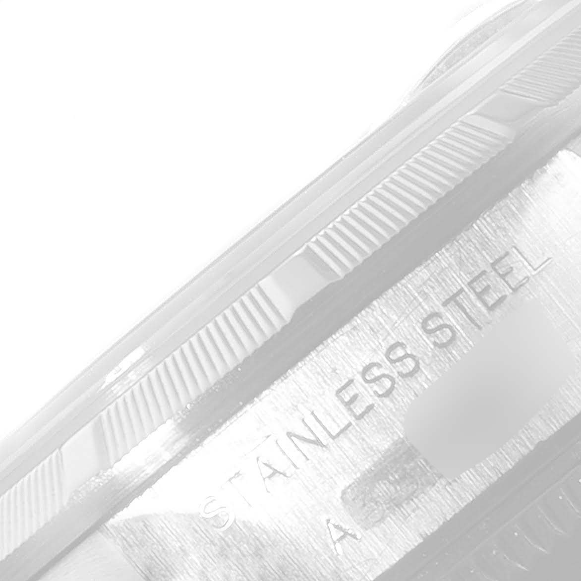 The image shows a close-up of the bezel and side case of a Rolex Date 79190 Women
s Stainless Steel Blue Dial 79190 Women
s Stainless Steel Blue Dial model watch with "STAINLESS STEEL" engraving.