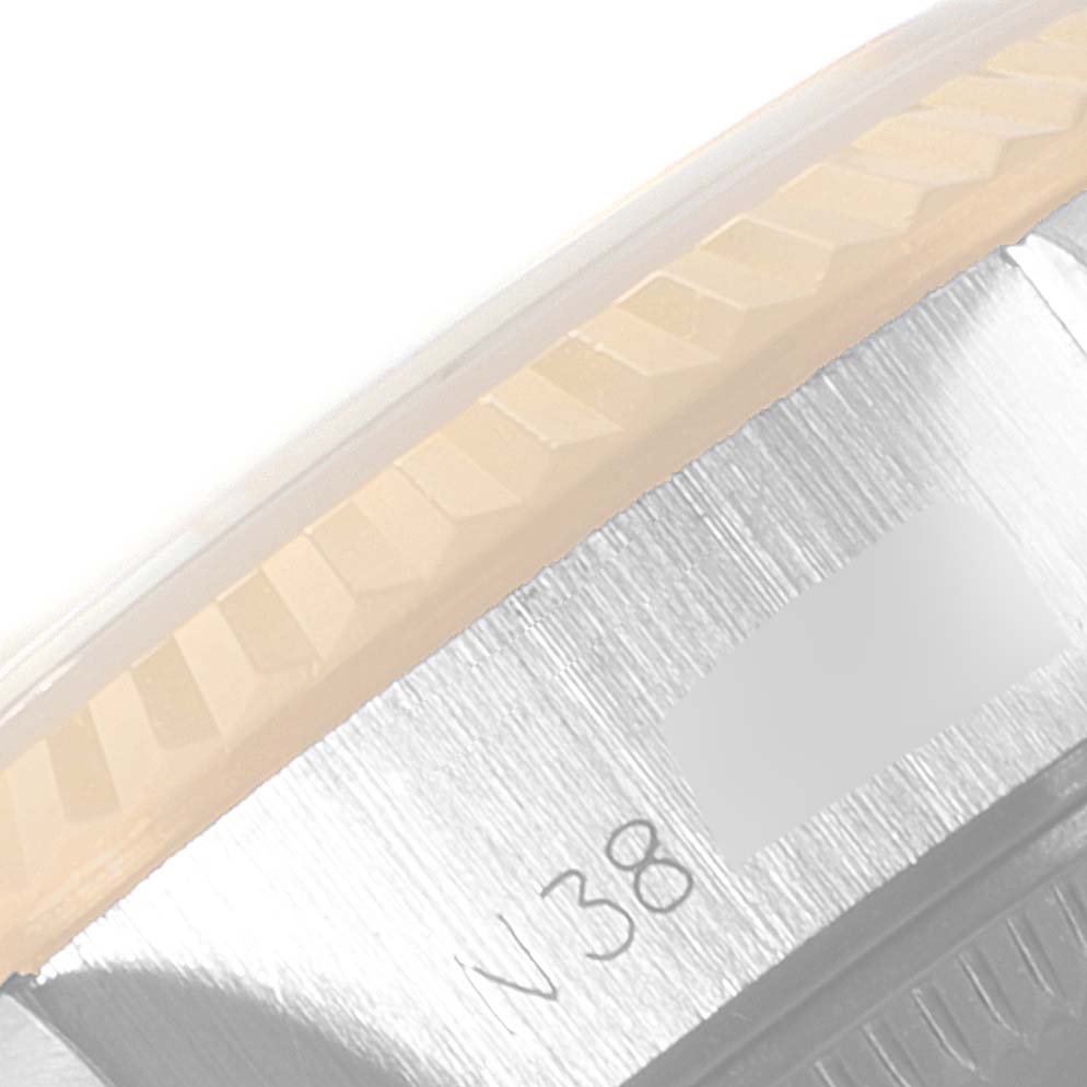 This image shows a close-up of the bezel and case side of a Rolex Datejust 69173 Women
s Steel and Gold (two tone) Champagne Dial 69173 Women
s Steel and Gold (two tone) Champagne Dial watch from an angled view.