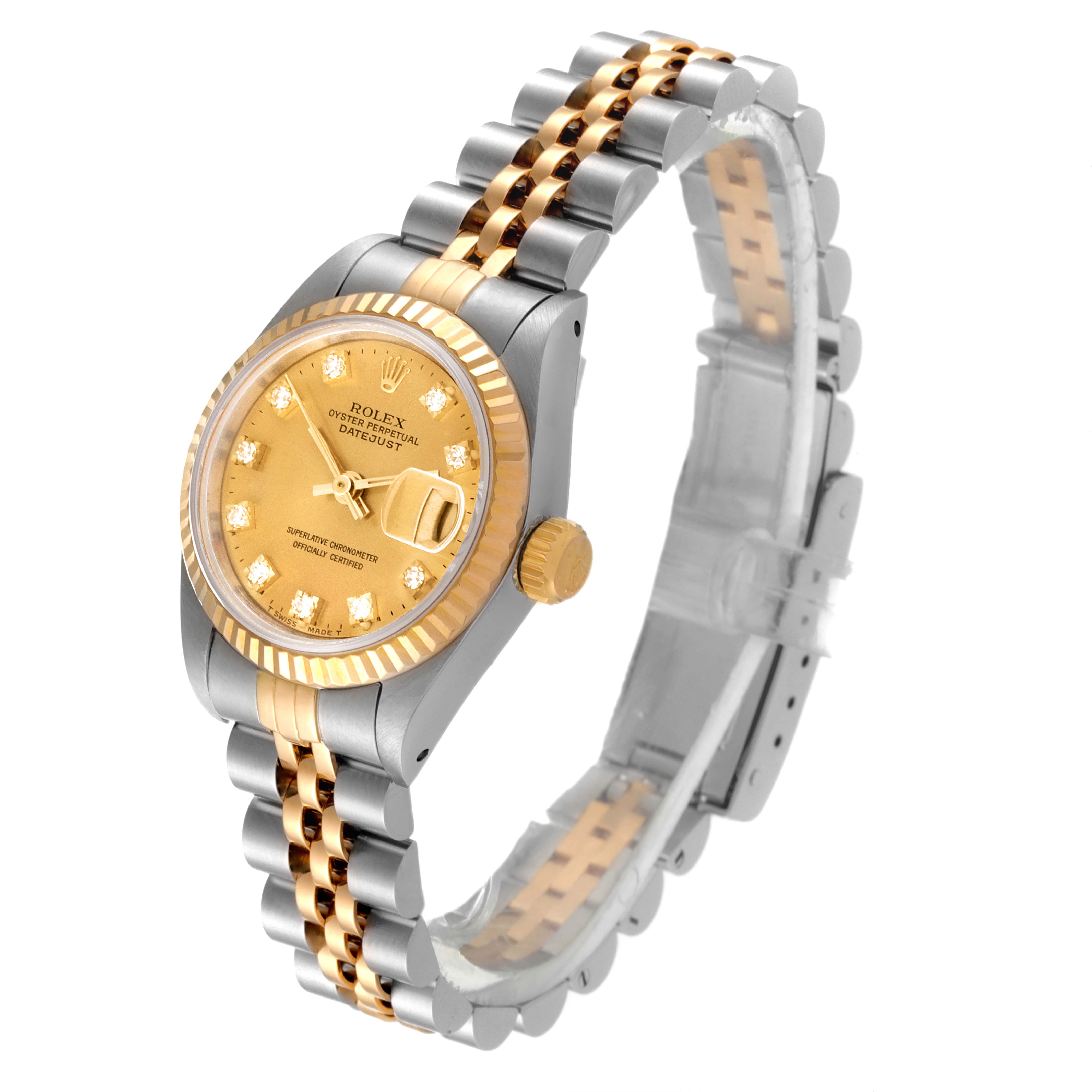 The Rolex Datejust 69173 Women
s Steel and Gold (two tone) Champagne Dial 69173 Women
s Steel and Gold (two tone) Champagne Dial watch is shown at an angled view, displaying its dial, fluted bezel, crown, and Jubilee bracelet.