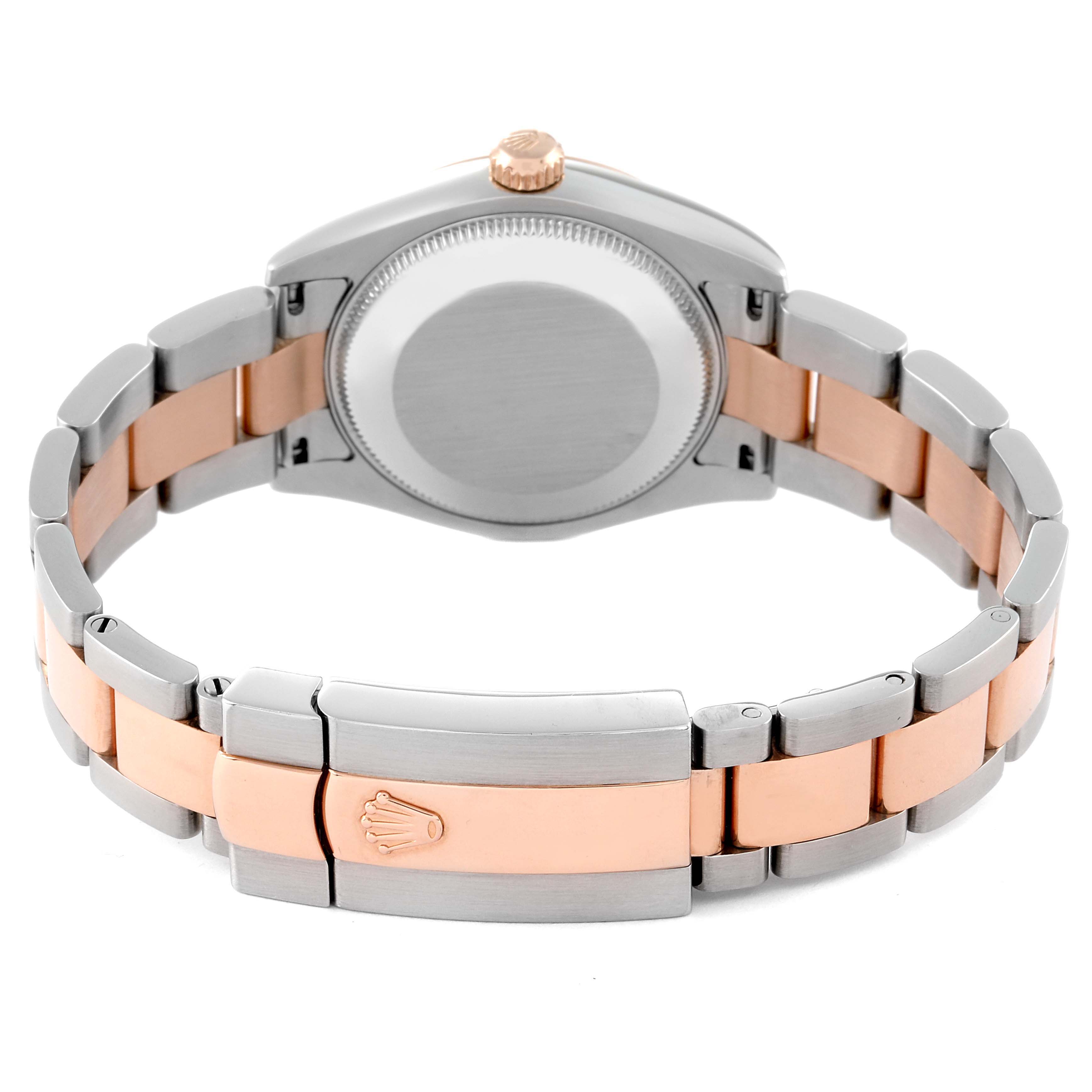 The image shows the back view of a Mid-Size Rolex watch, highlighting the bracelet, clasp, and caseback.