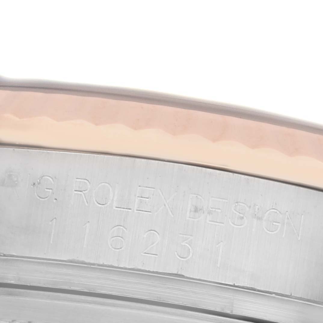 The image shows the side of the bezel and case of a Rolex Datejust 116231 Men's Steel and Gold (two tone) White Dial 116231 Men's Steel and Gold (two tone) White Dial, highlighting the engraved model number.